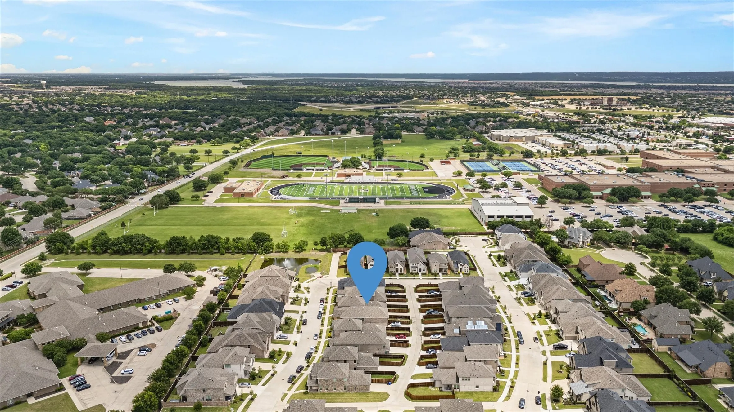 Aerial perspective showcasing a residential community with organized street layouts and green spaces