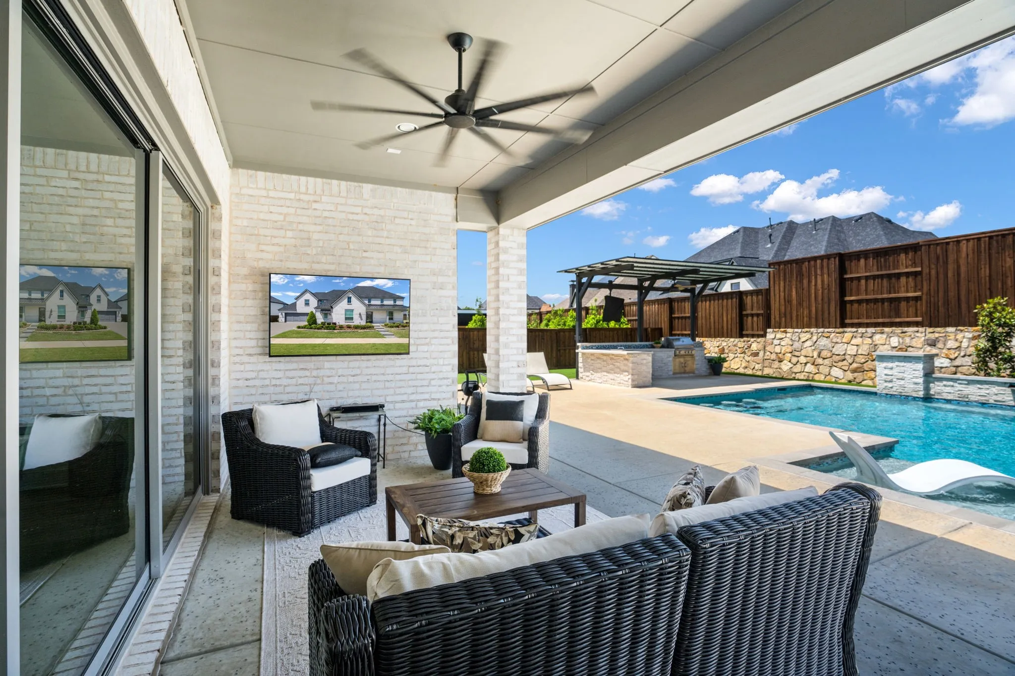 view of covered patio with view of pool