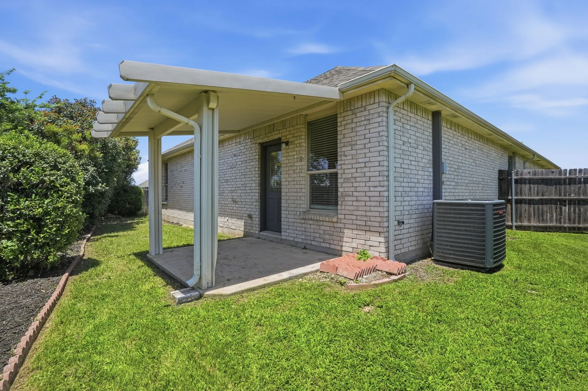 Big pool size side yard on this home,