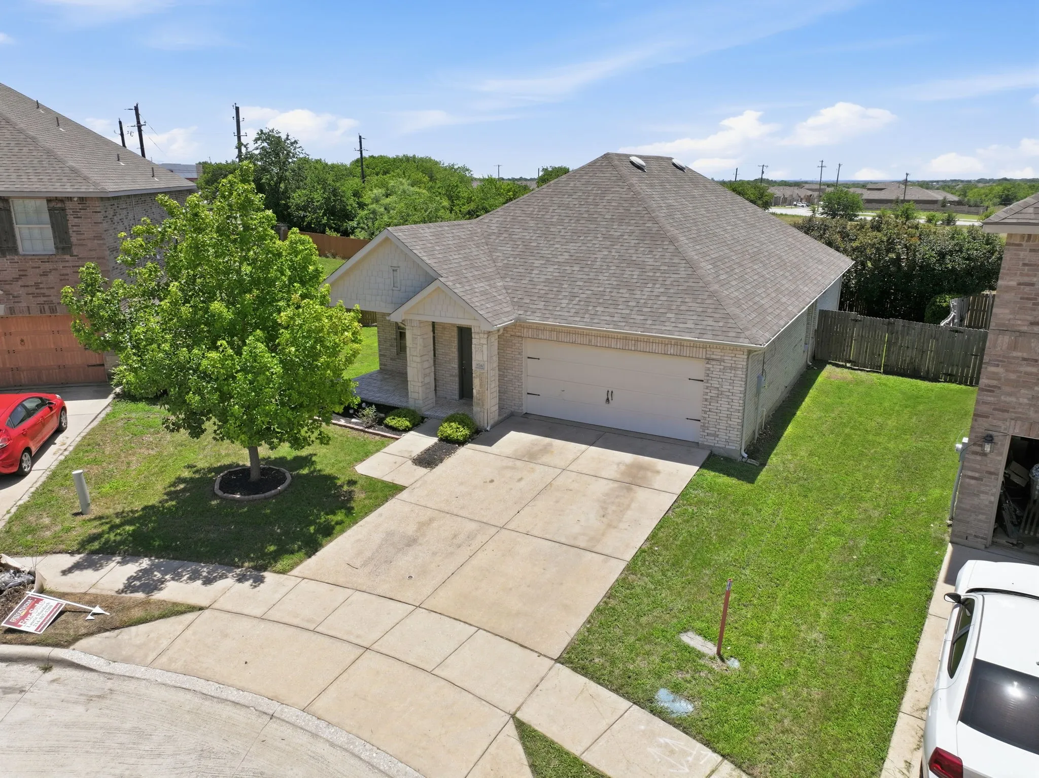 Single-story brick exterior with an attached garage