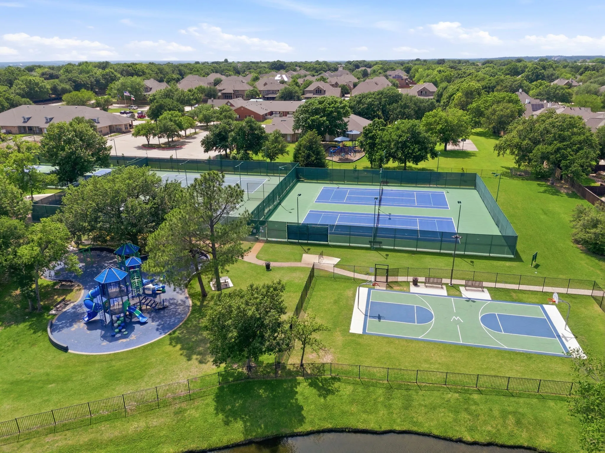 fitness center, pickleball courts, tennis courts, and basketball courts, 5 fishing ponds stacked with fish, playgrounds for young residents, and miles of walking trails that pass by the park and ponds