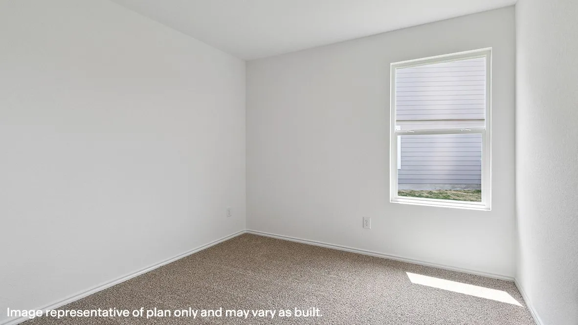 Bright interior space featuring neutral wall tones and a single window with blinds