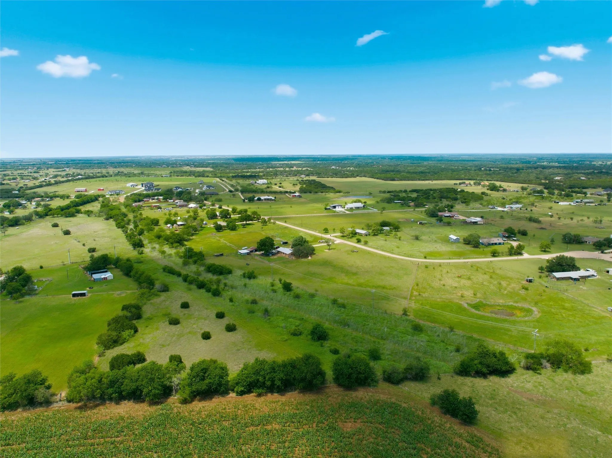 Expansive open land with scattered residential structures