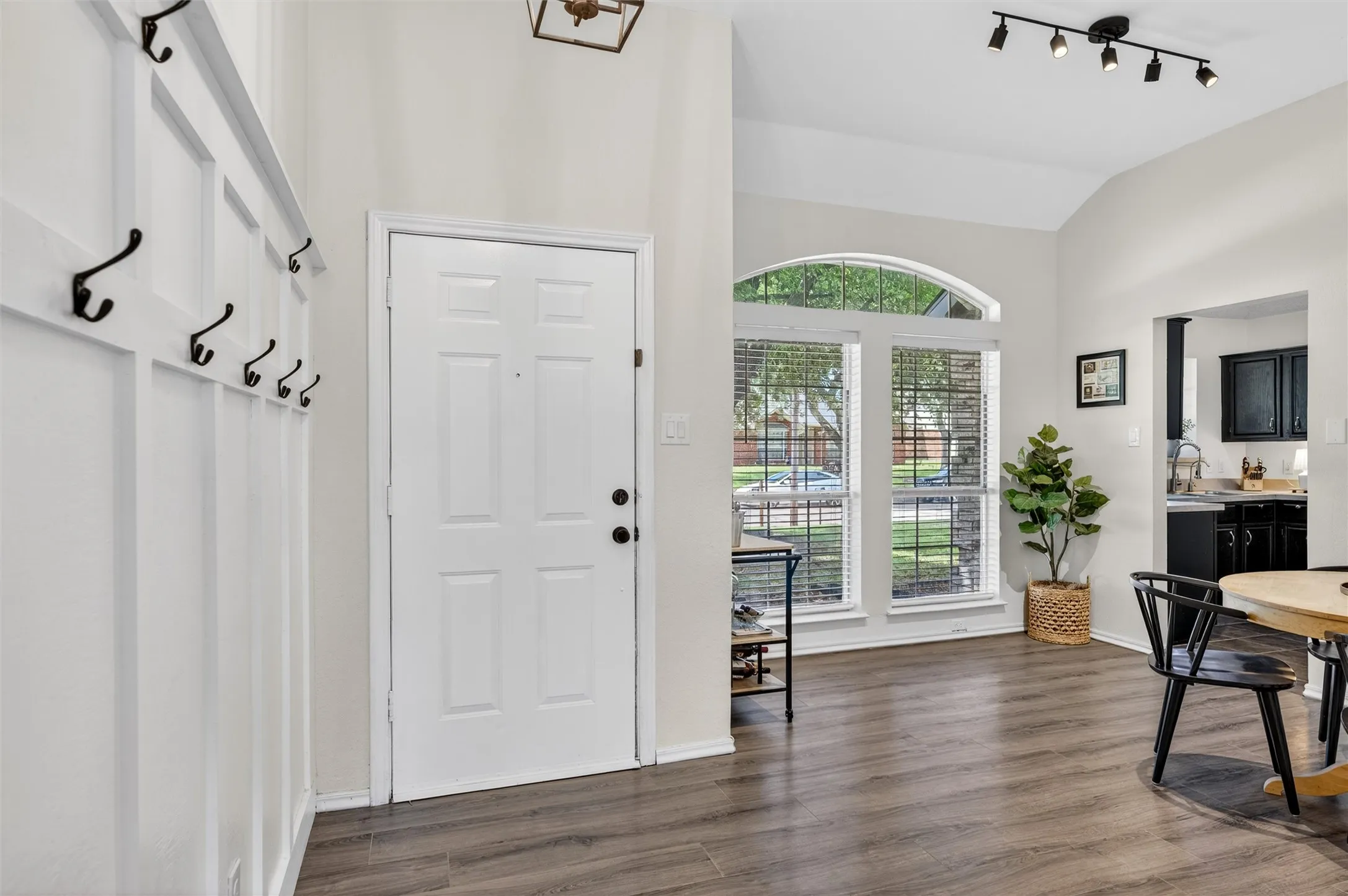 Lovely LVP flooring at entry and dining area