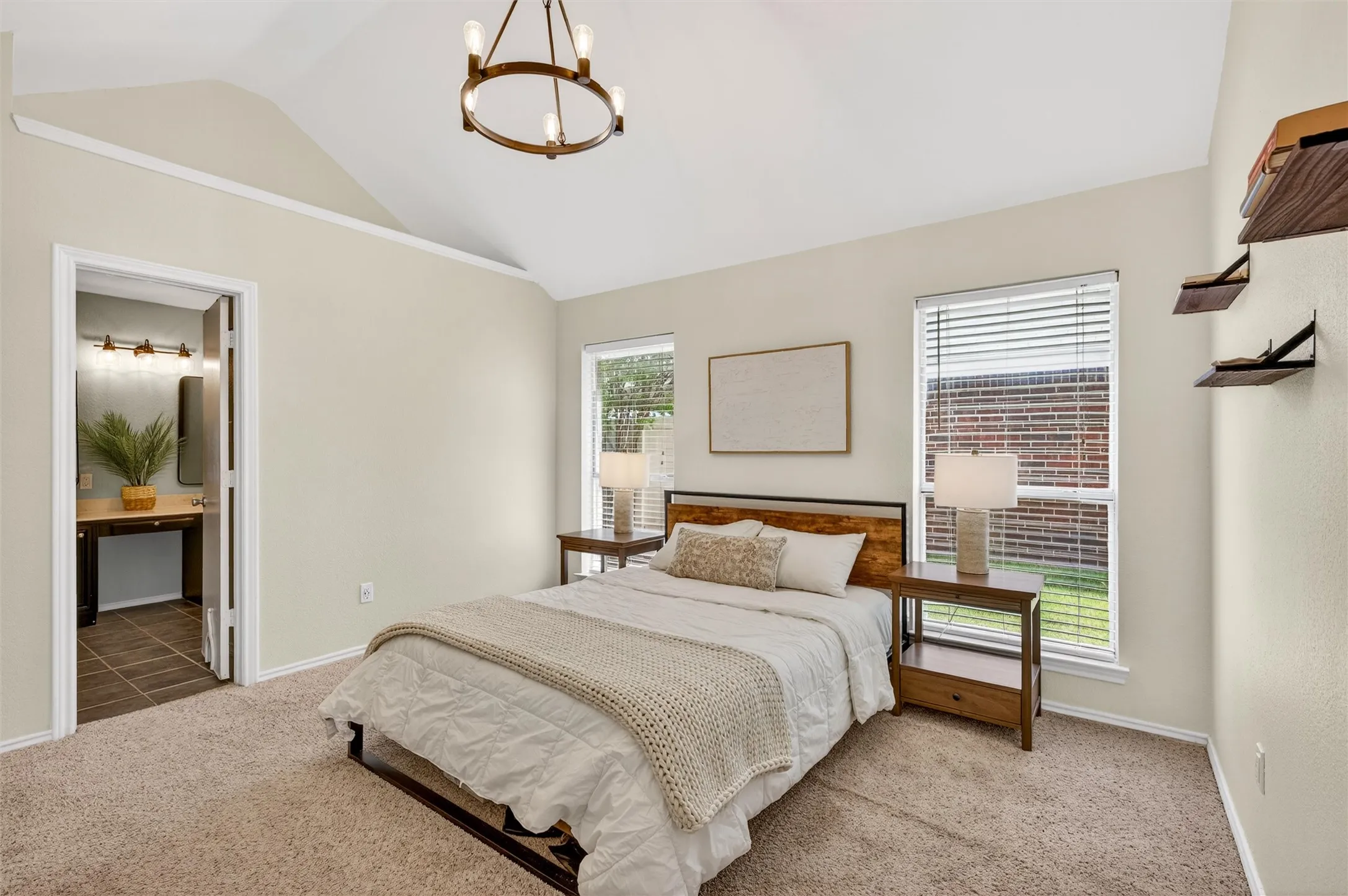 NEW CARPET! Light and bright primary bedroom with ledge above the ensuite bathroom