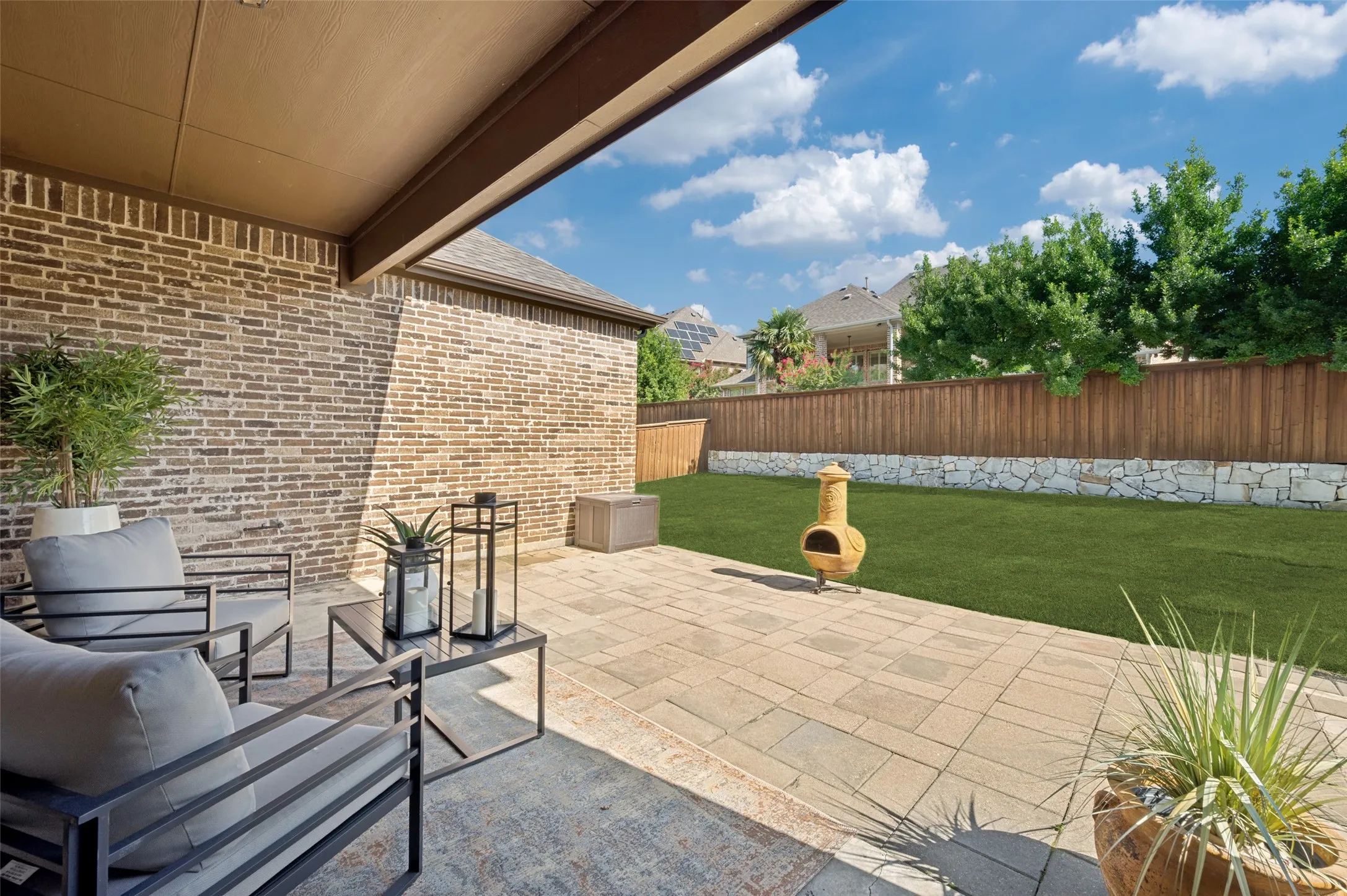 Enjoy year-round outdoor living on the spacious covered patio overlooking the private backyard. With ample room for outdoor dining and lounging, this inviting space is perfect for relaxing, entertaining guests, or enjoying peaceful Texas evenings.