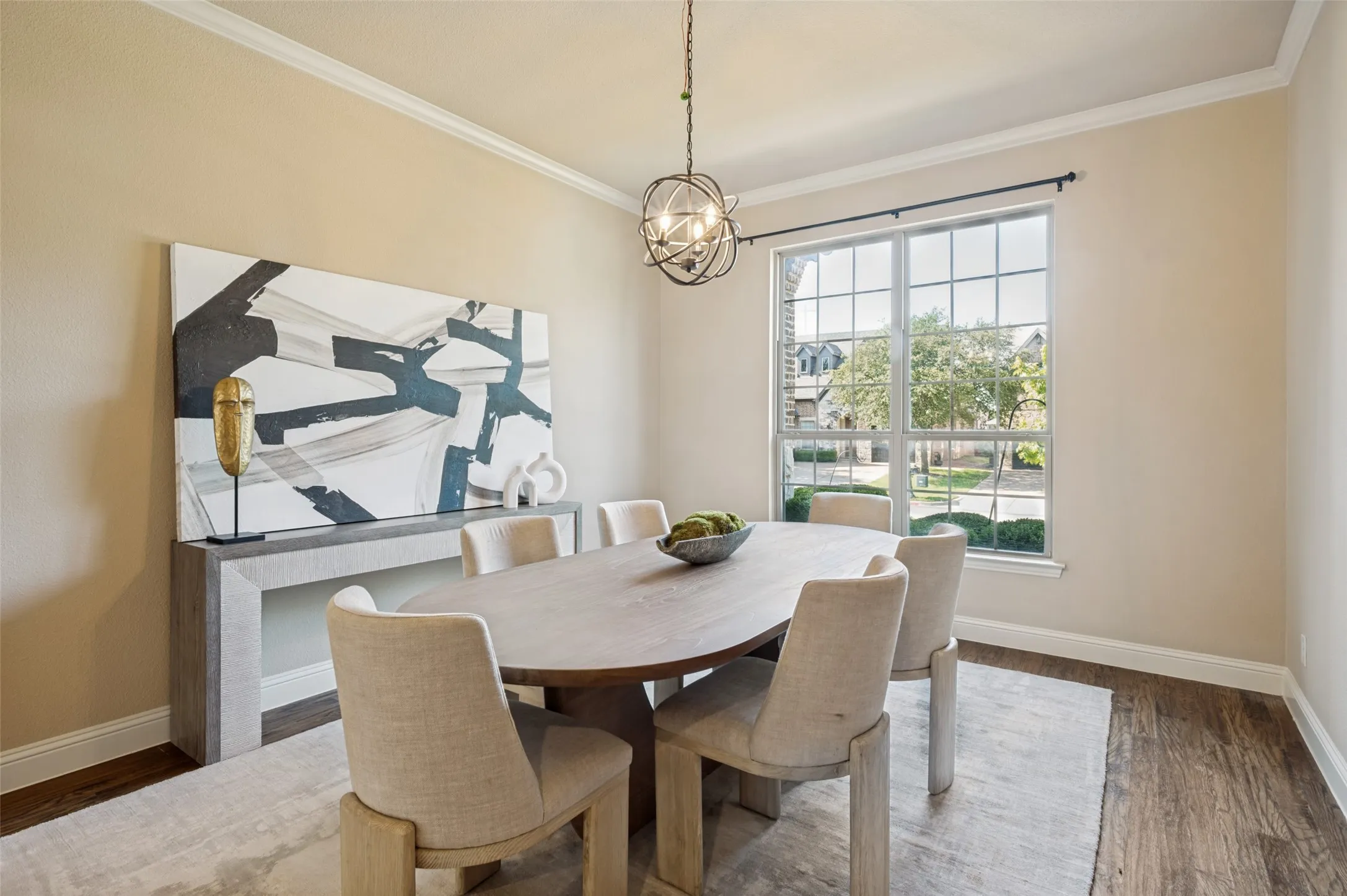 Designed for memorable gatherings, the elegant formal dining room showcases rich hardwood floors, abundant natural light, and a striking designer chandelier. This sophisticated space provides the perfect setting for everything from intimate family dinners to holiday celebrations.
