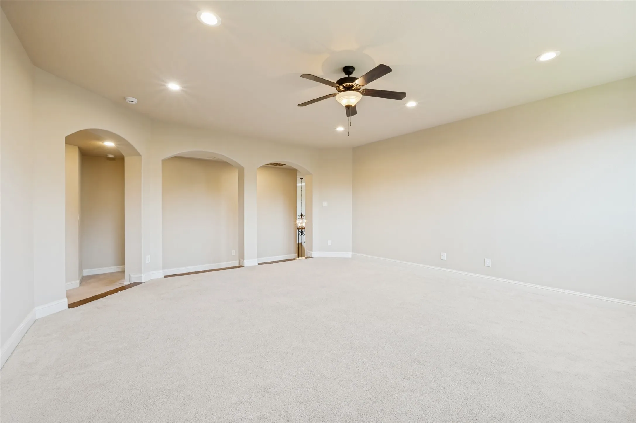 Spacious upstairs game room offering endless possibilities for entertaining, relaxing, or creating the perfect play space. This versatile retreat features an open layout with plenty of room for a pool table, gaming area, or lounge, making it an ideal extension of the home's living space.