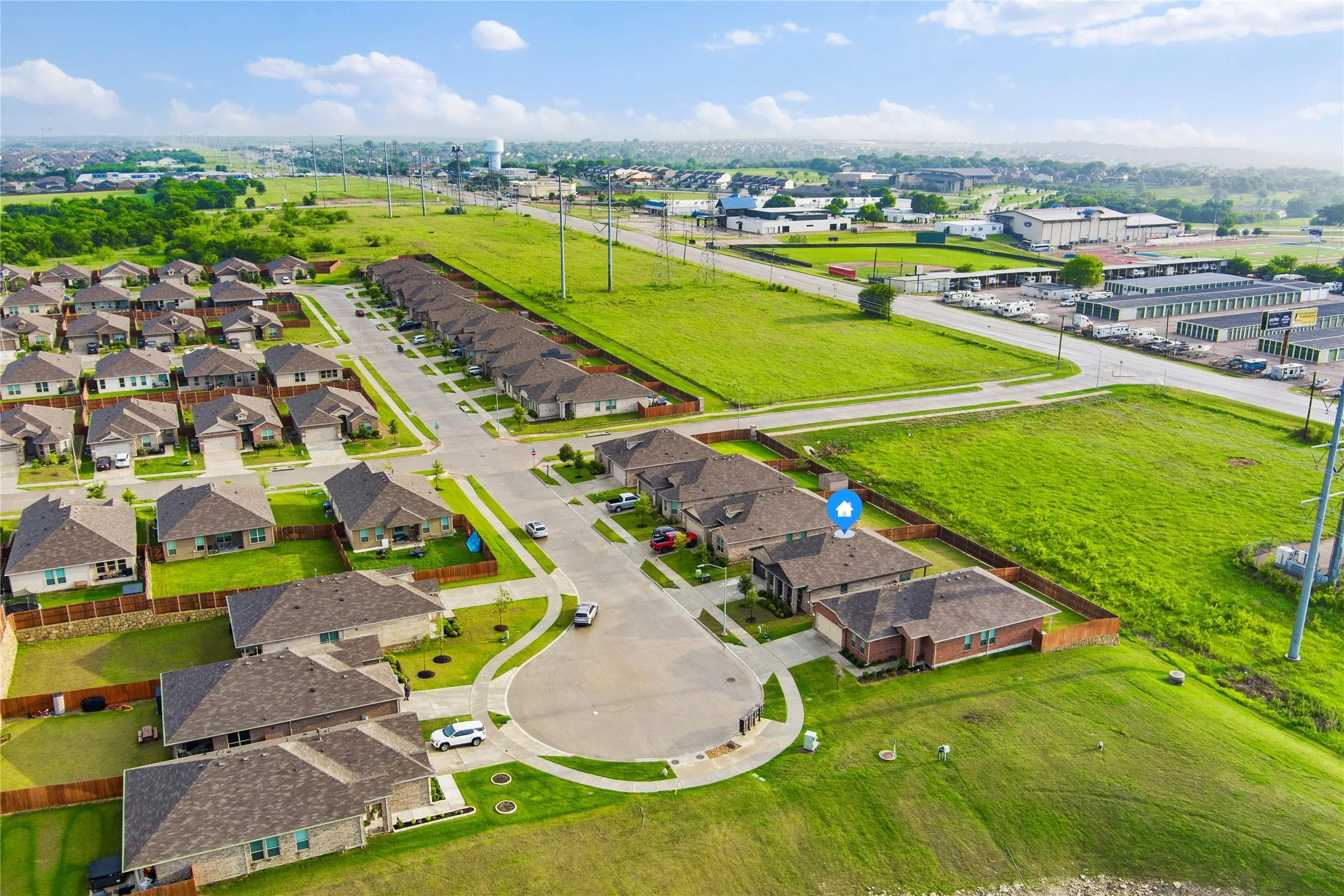 Aerial perspective showcasing a residential development with numerous single-story homes