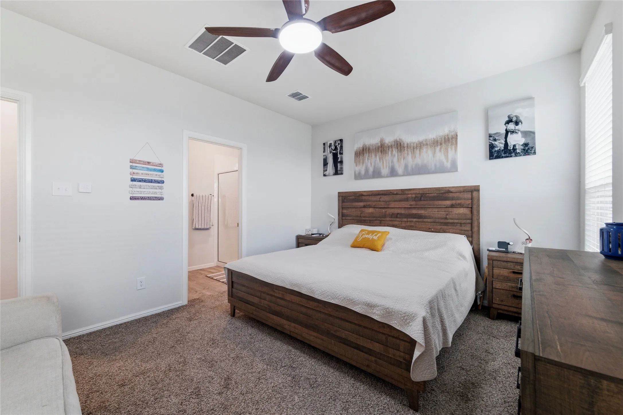 Bedroom featuring a wood-finish bed frame and headboard, recessed lighting, and a ceiling fan with light fixture