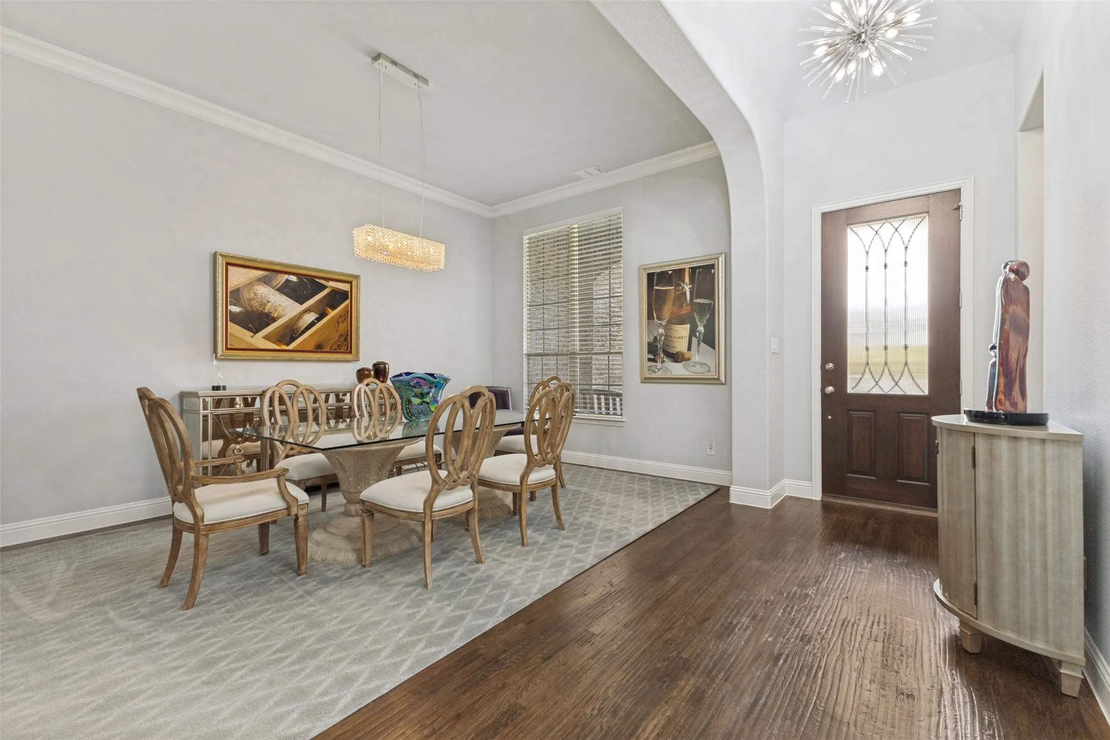Real wood floors, upgraded chandeliers and arches upon entry.