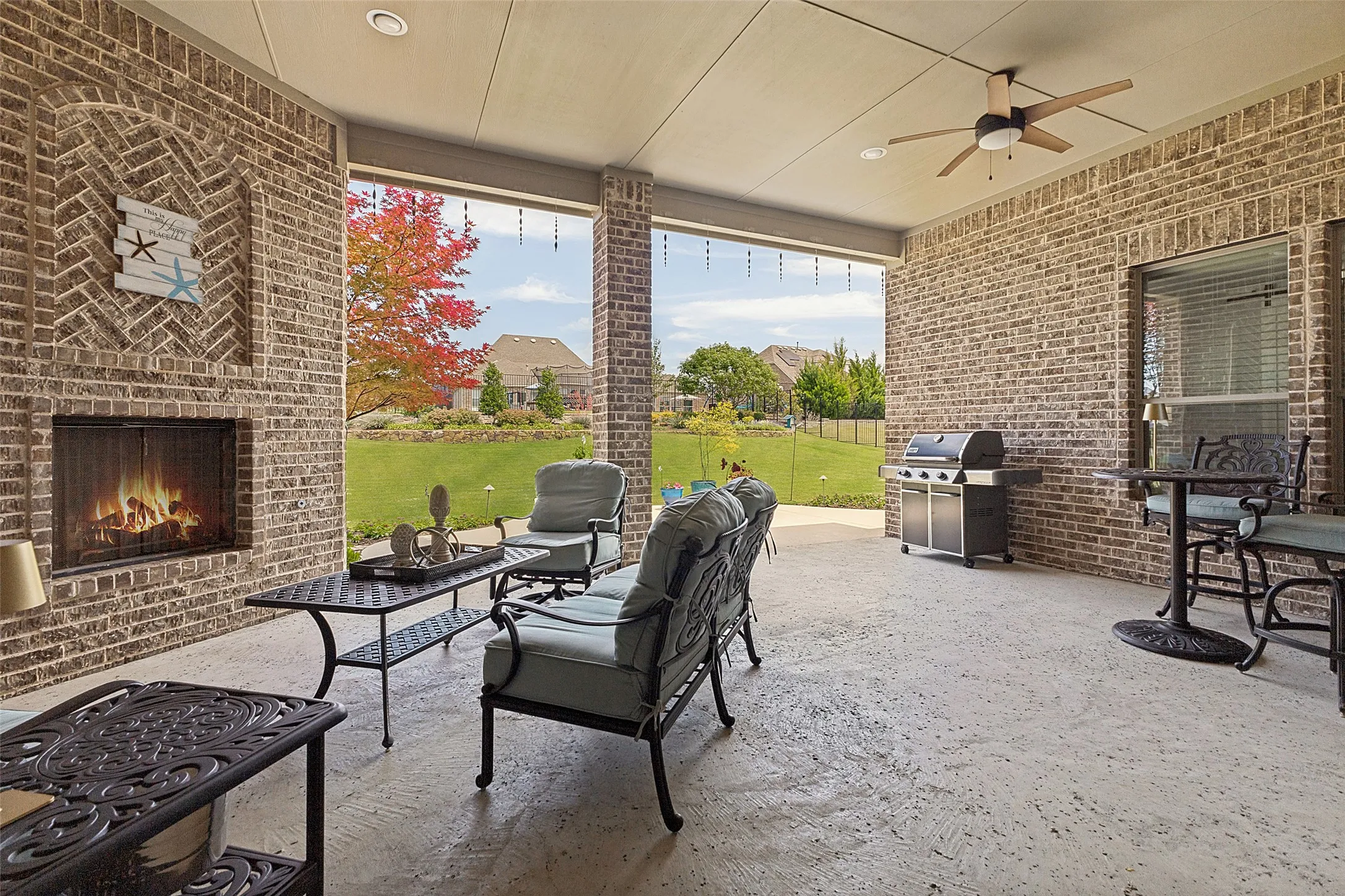 The extended covered patio offers another living space to enjoy. There is a plug behind the artwork to add a TV.