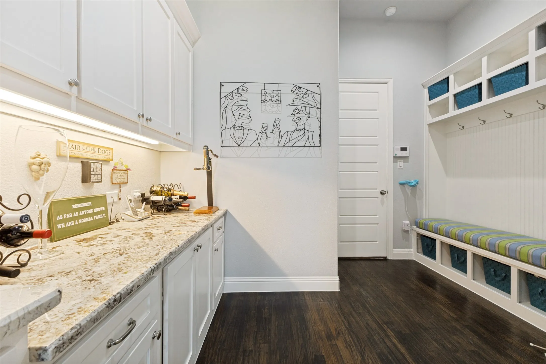 The kitchen extends to a Mud Room off the garage, and great storage with pull out cabinetry on the left.