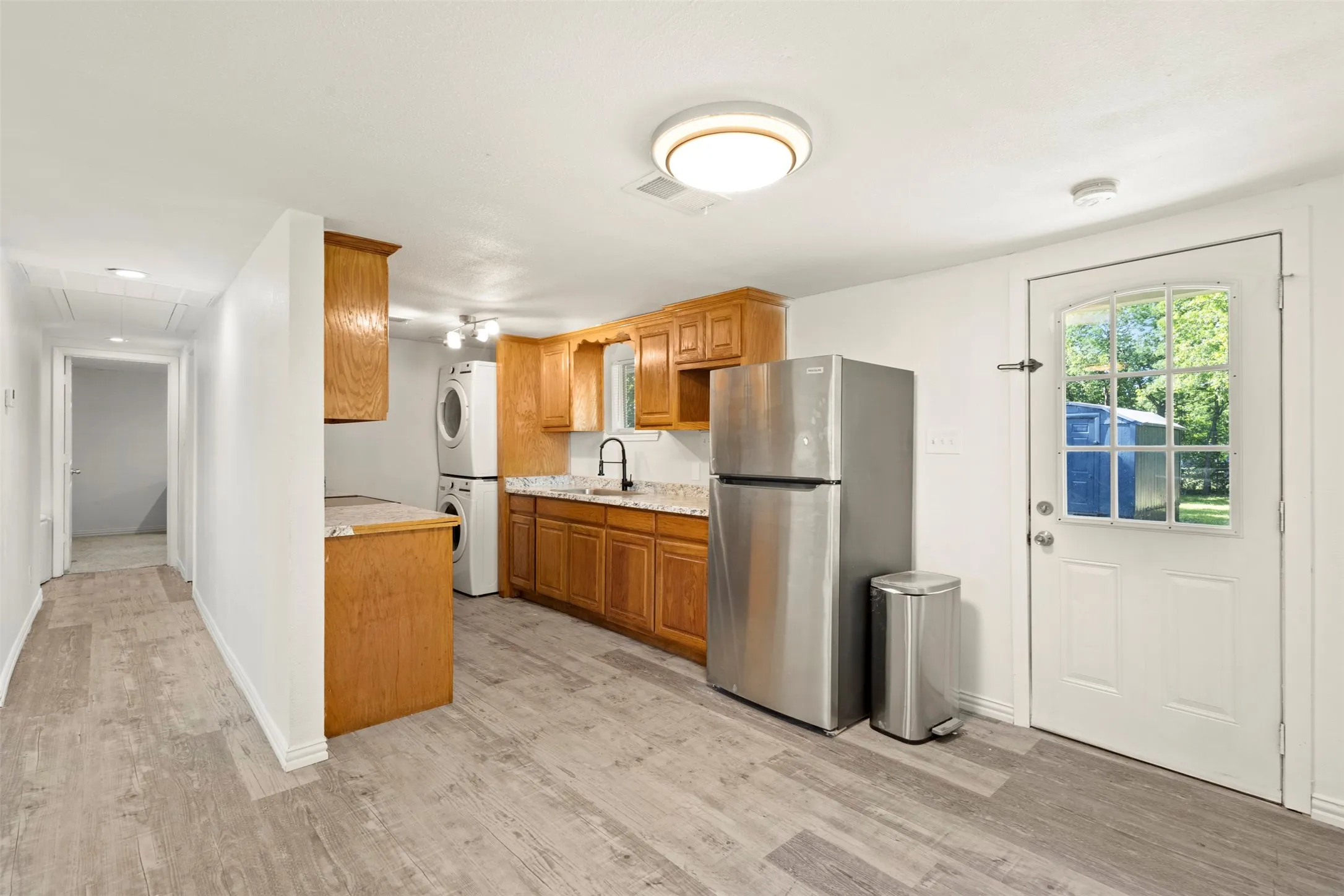 Kitchen is very functional and washer, dryer and refrigerator stay!