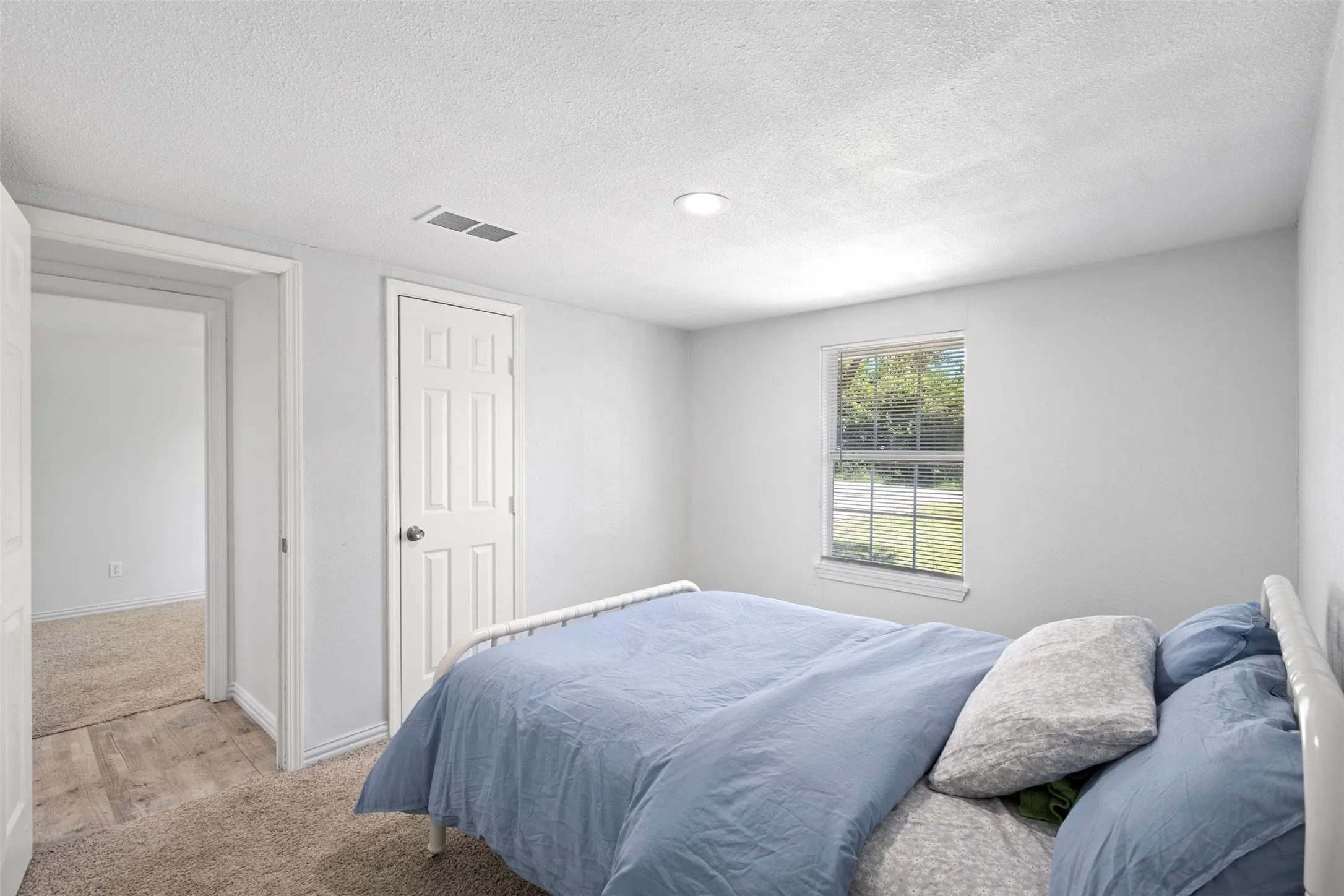 Another view of this secondary bedroom with generous closet space.