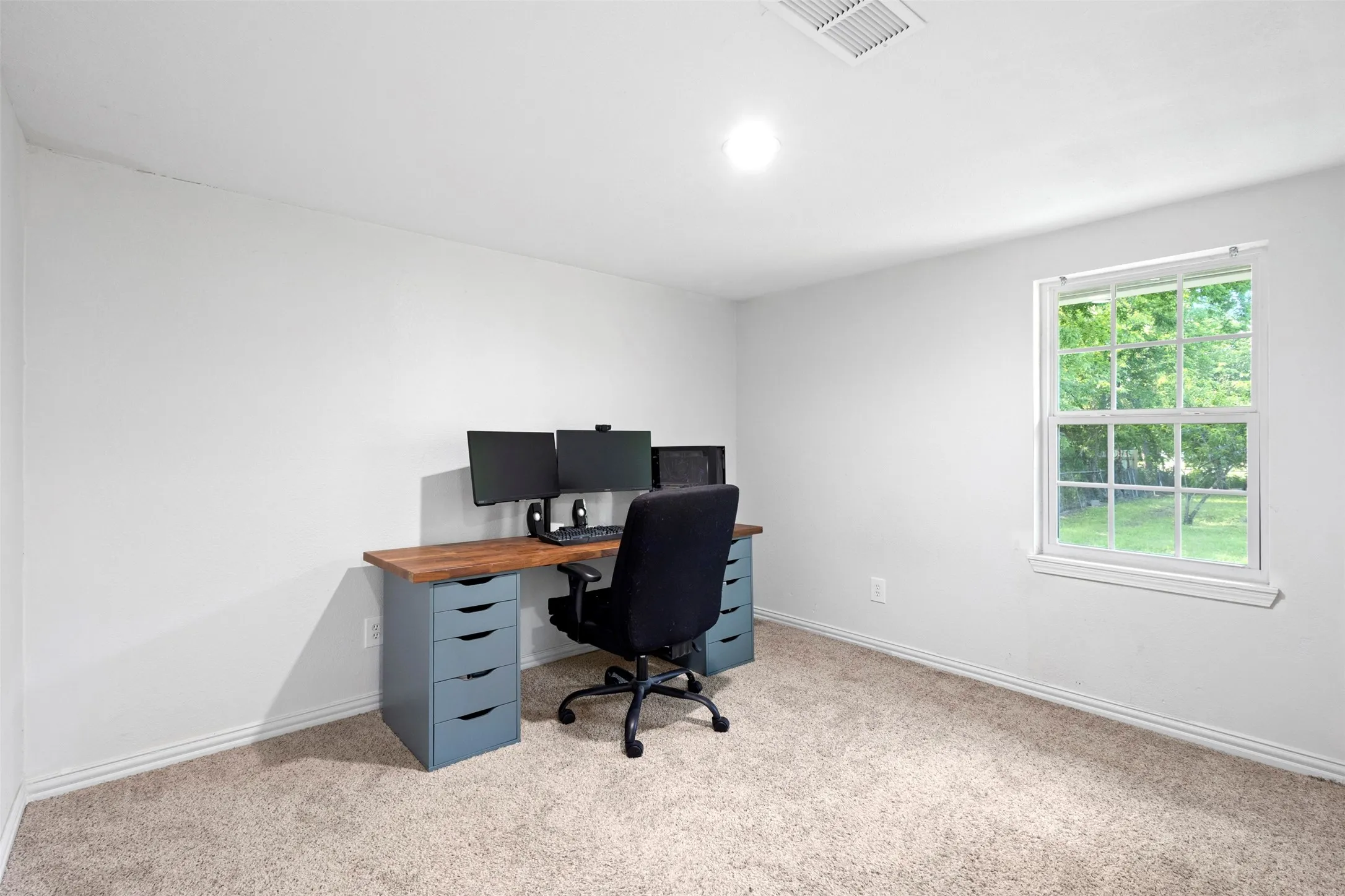 Bathroom has contemporary lighting and fixtures and natural light as well!