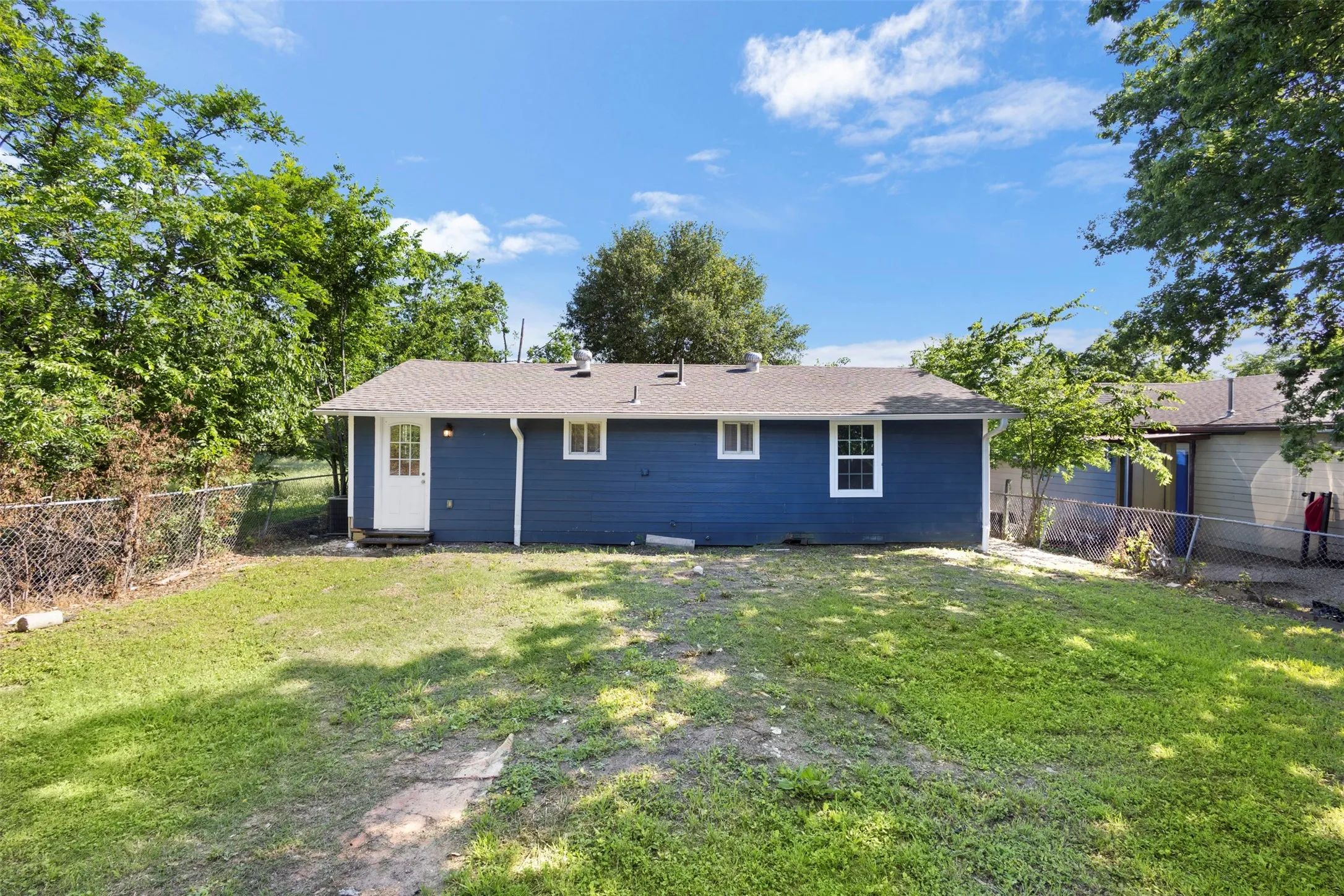 This lovely cottage is on an expansive lot with plenty of room for a fire pit or other back yard enhancements!