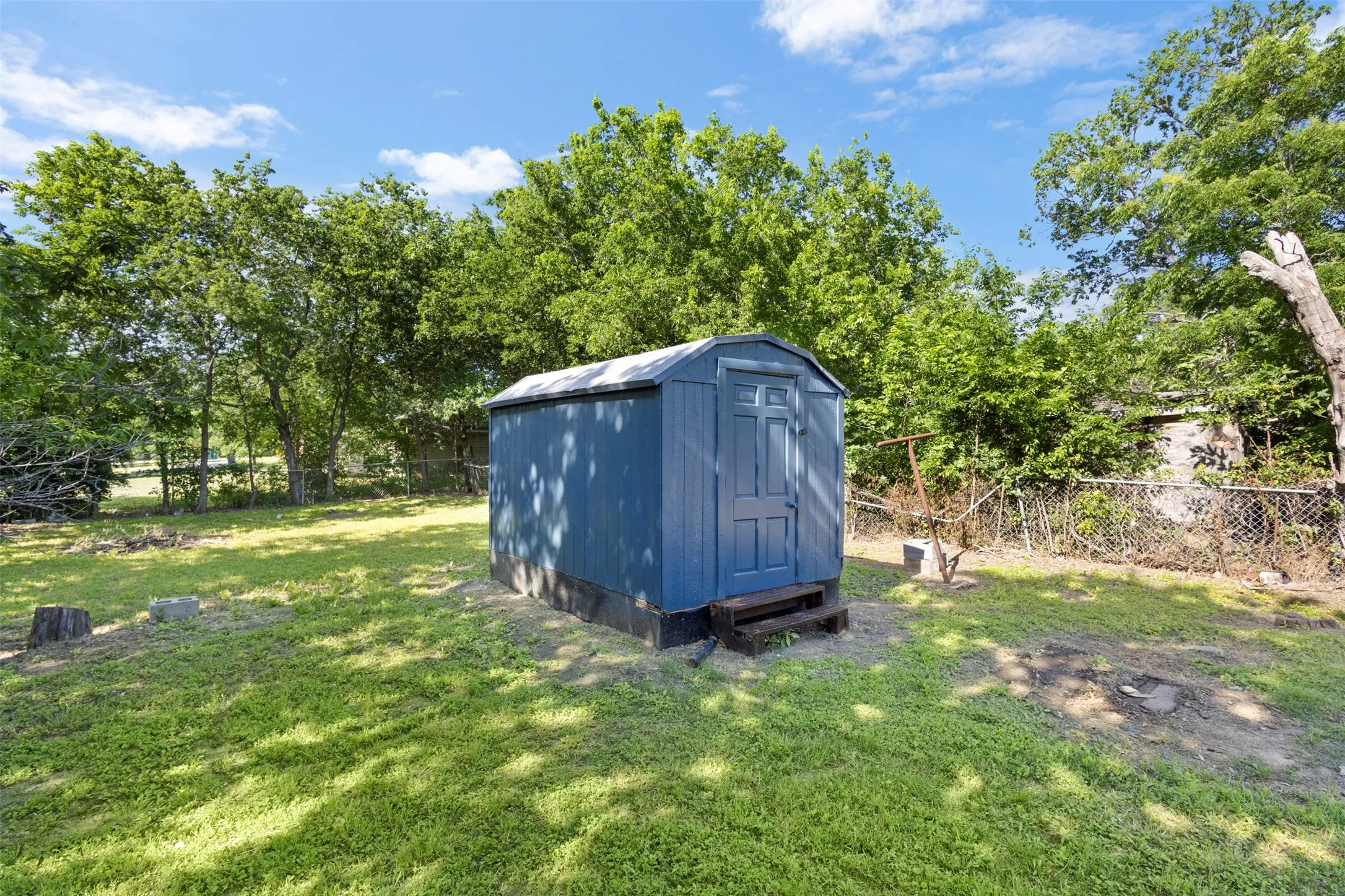 This storage building stays with property and provides additional storage for your yard equipment.