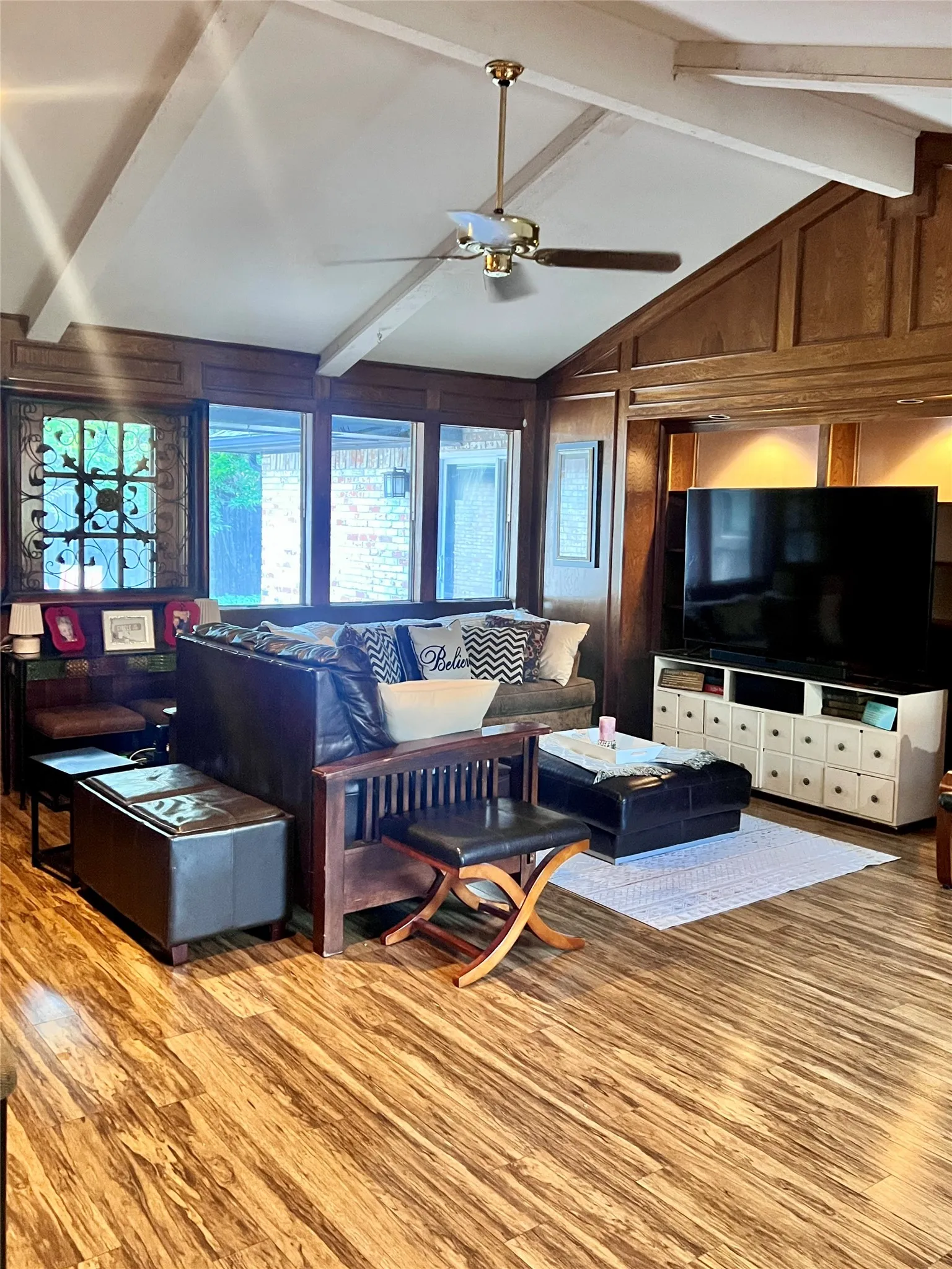 Living room with natural wood paneling