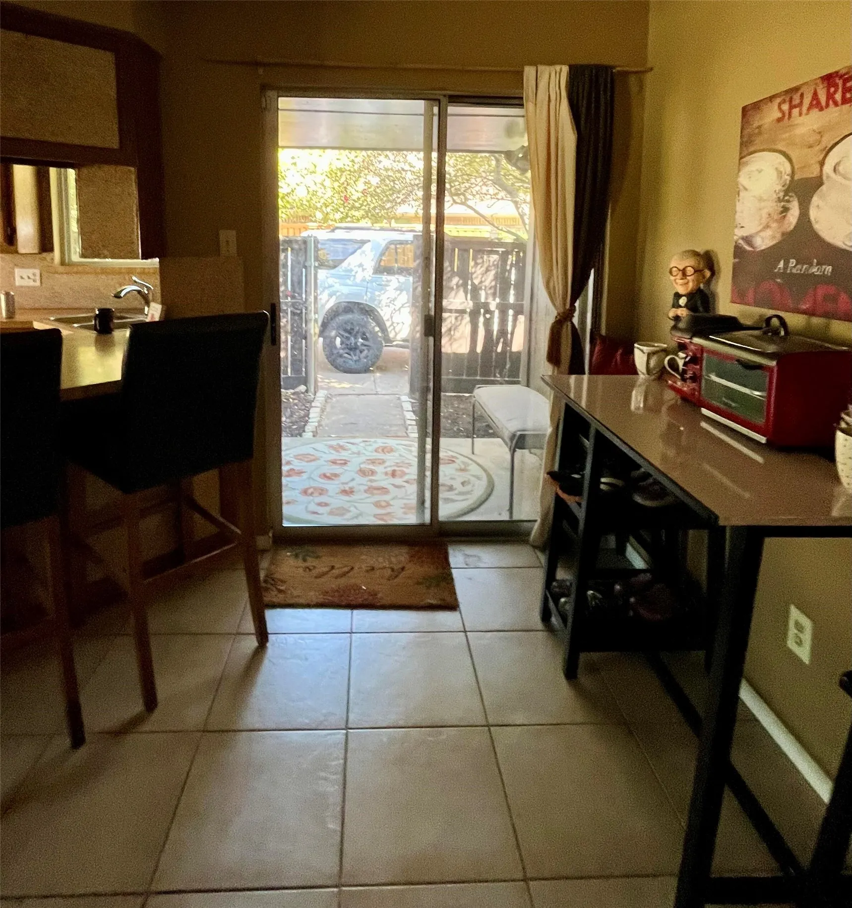 Breakfast nook with sliding side door to side yard