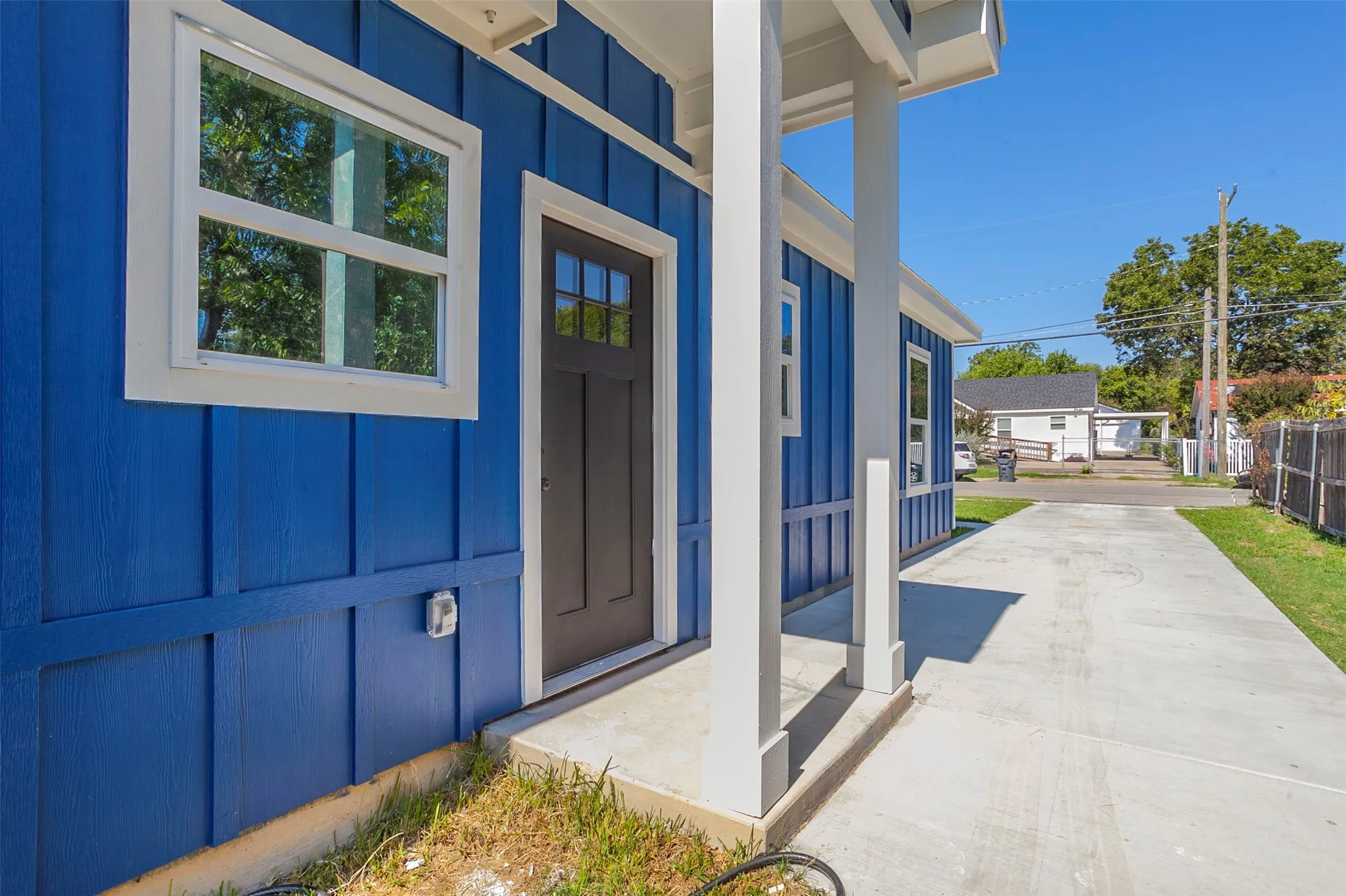 Bright blue exterior with vertical board and batten siding