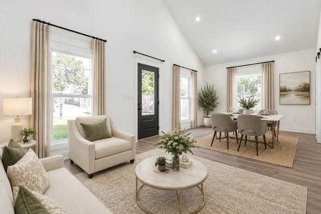Virtual staging -Vaulted ceilings, recessed lighting, wood-finish flooring, multiple windows, and a glass-paneled exterior door