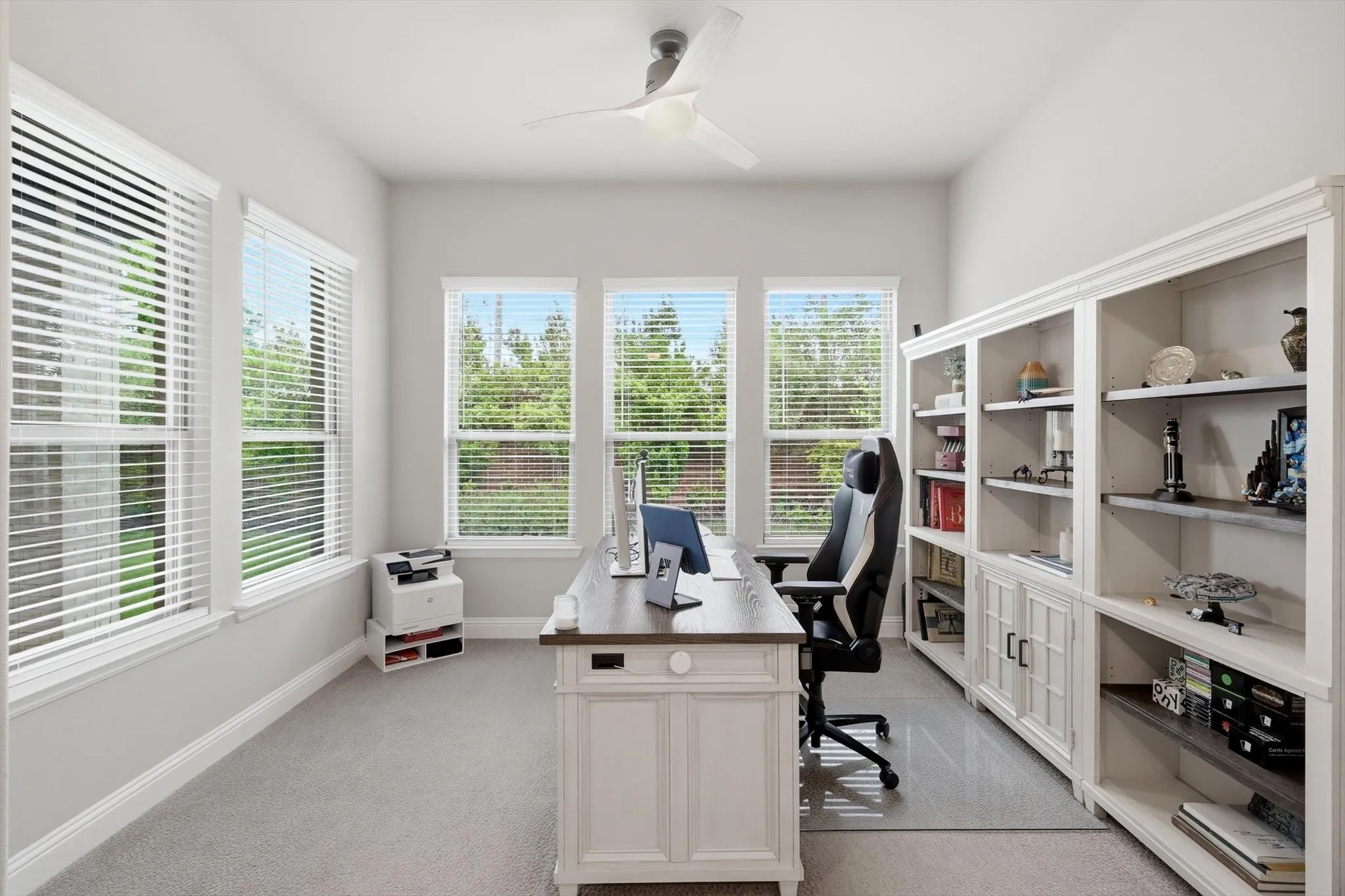Vaulted ceilings accented by a wood beam and an extended sitting area, perfect for a home gym or reading nook!