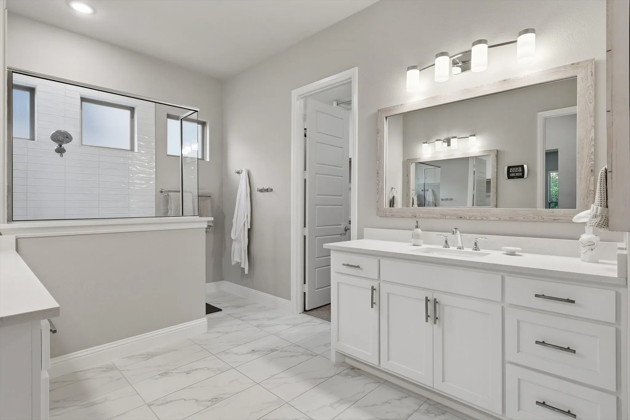 Generous walk-in shower, separate vanities, and 2 oversized walk-in closets.