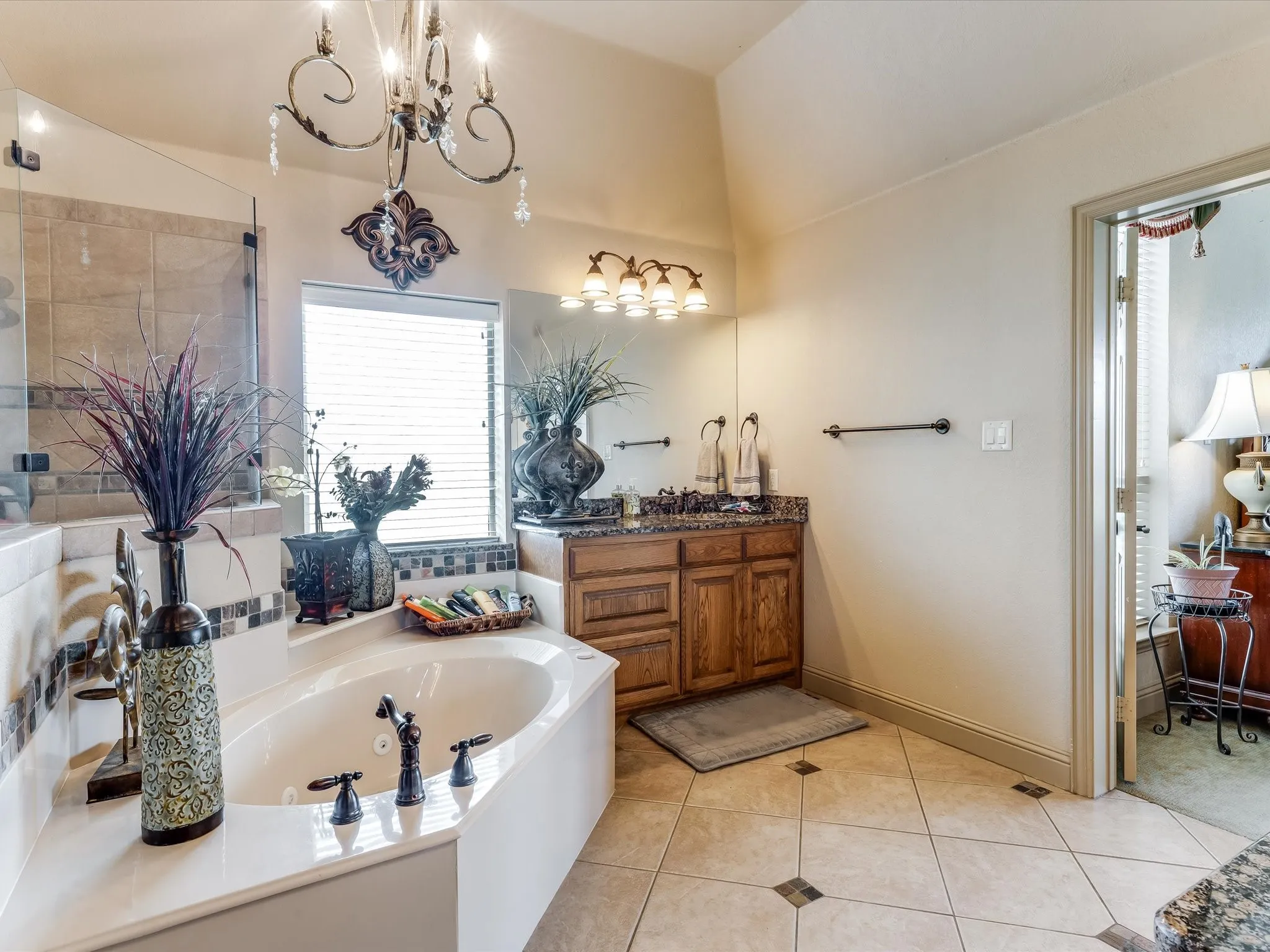 Bathroom featuring a spacious built-in soaking tub with dark bronze fixtures