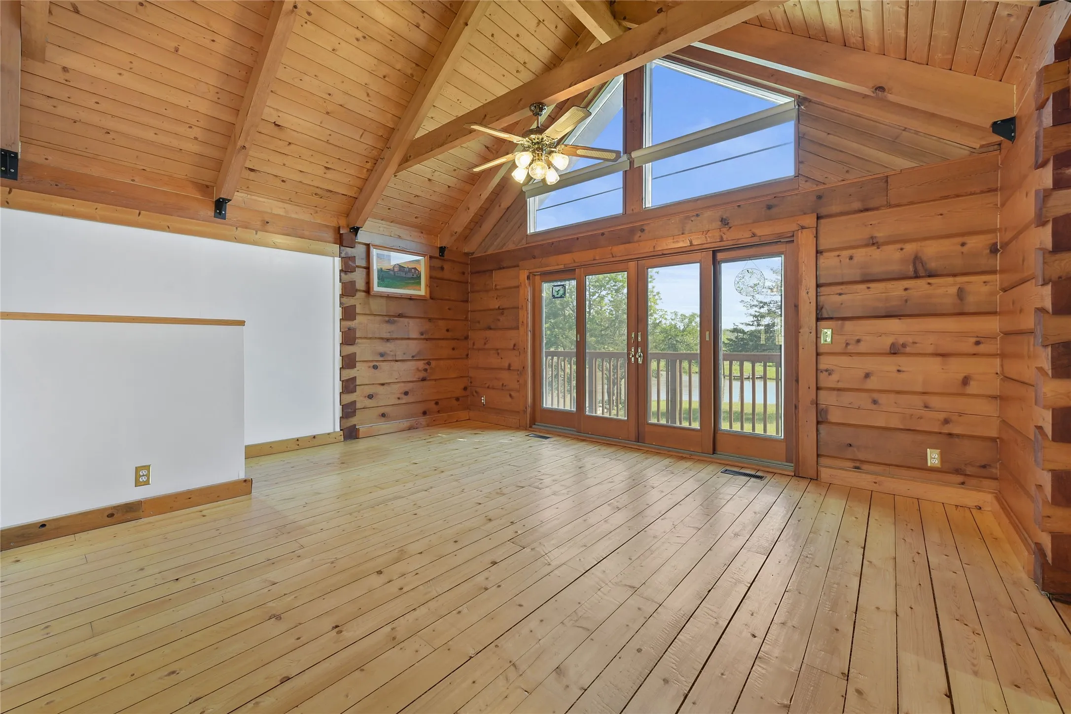 Western Red Cedar logs, Pine Floors. Without Virtual Staging.
