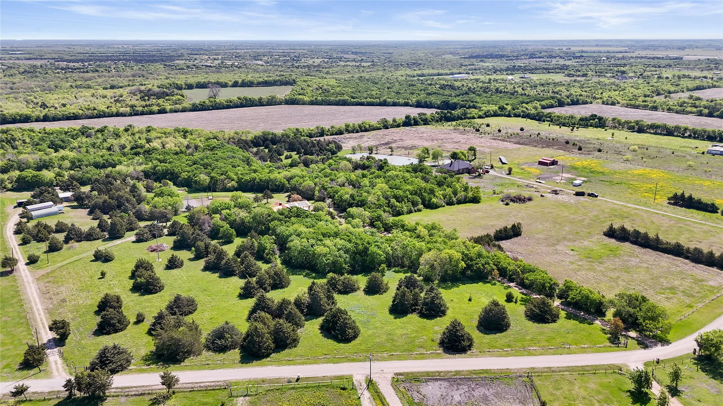700' secondary Drive to Shop/Apartment Follows Property Boundary on the left, Ewing Road across bottom. Main 600' Driveway Bottom Right corner. Center of picture right edge shows tree lined 3rd Driveway, and Sitework for another Residence that follows property line.