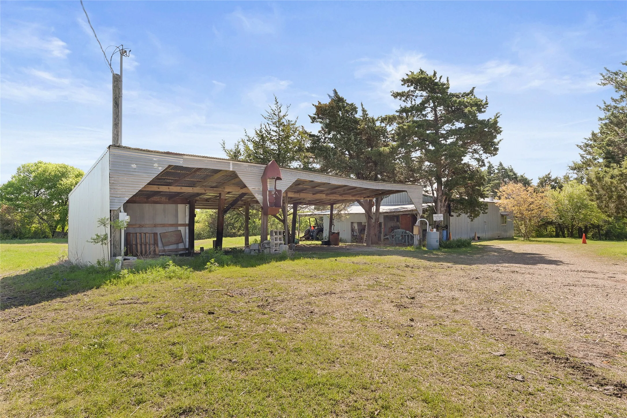 Workshop is one car garage space with Apartment.40' Pole barn provides four car covered parking.