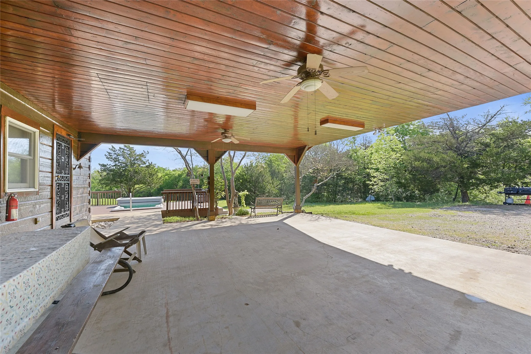 Enter home via carport door. View of Deck, Swim Spa.