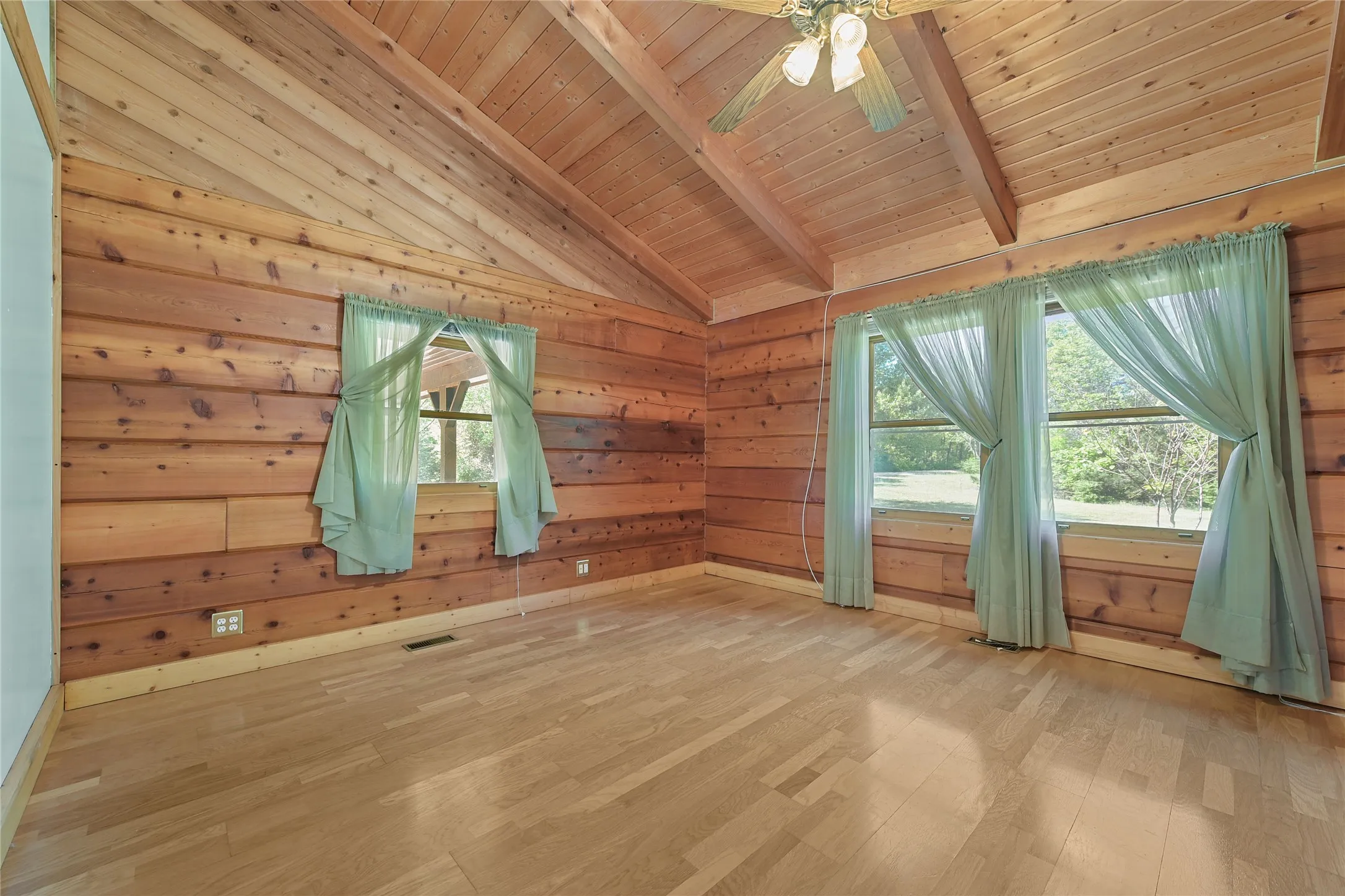 Red Cedar, Engineered Flooring. Single window view to carport, double window to Front yard, and 600'driveway.