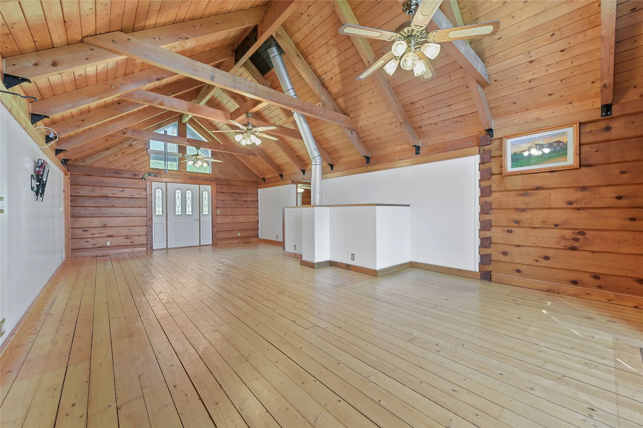 Red Cedar and Pine. Flue from Free Standing Fireplace on Lower Level. Ceiling Fans, and artists rendering of home. Without Virtual Staging.