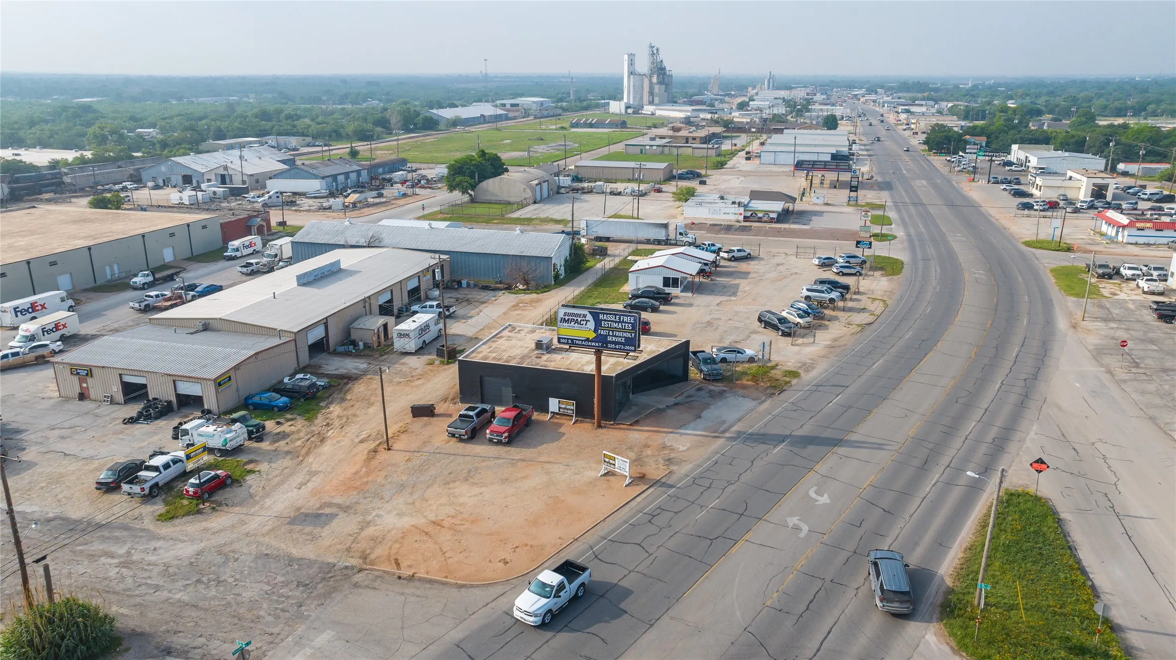 Industrial property featuring multiple buildings with metal siding and roofs