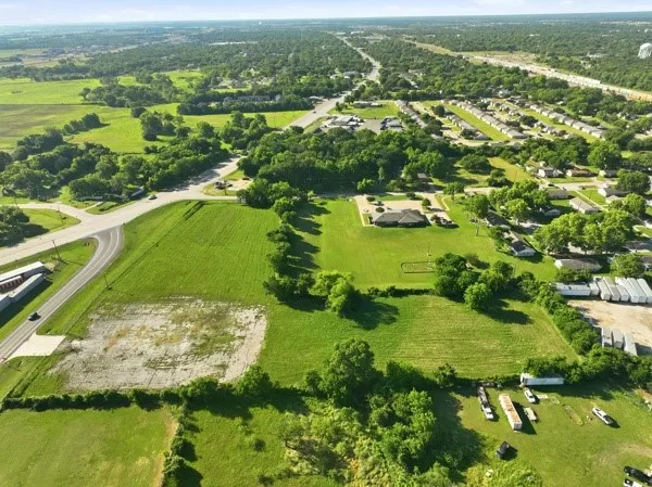 Expansive aerial perspective showcasing a verdant landscape with mature trees