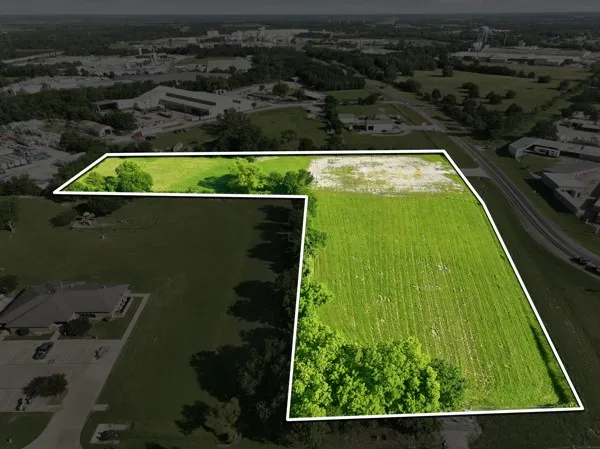 Expansive land parcel featuring a combination of cleared and partially wooded areas
