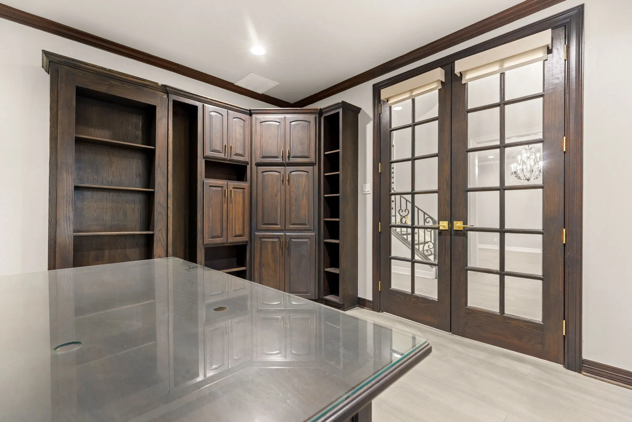 Custom built-in cabinetry and shelving with a dark wood finish