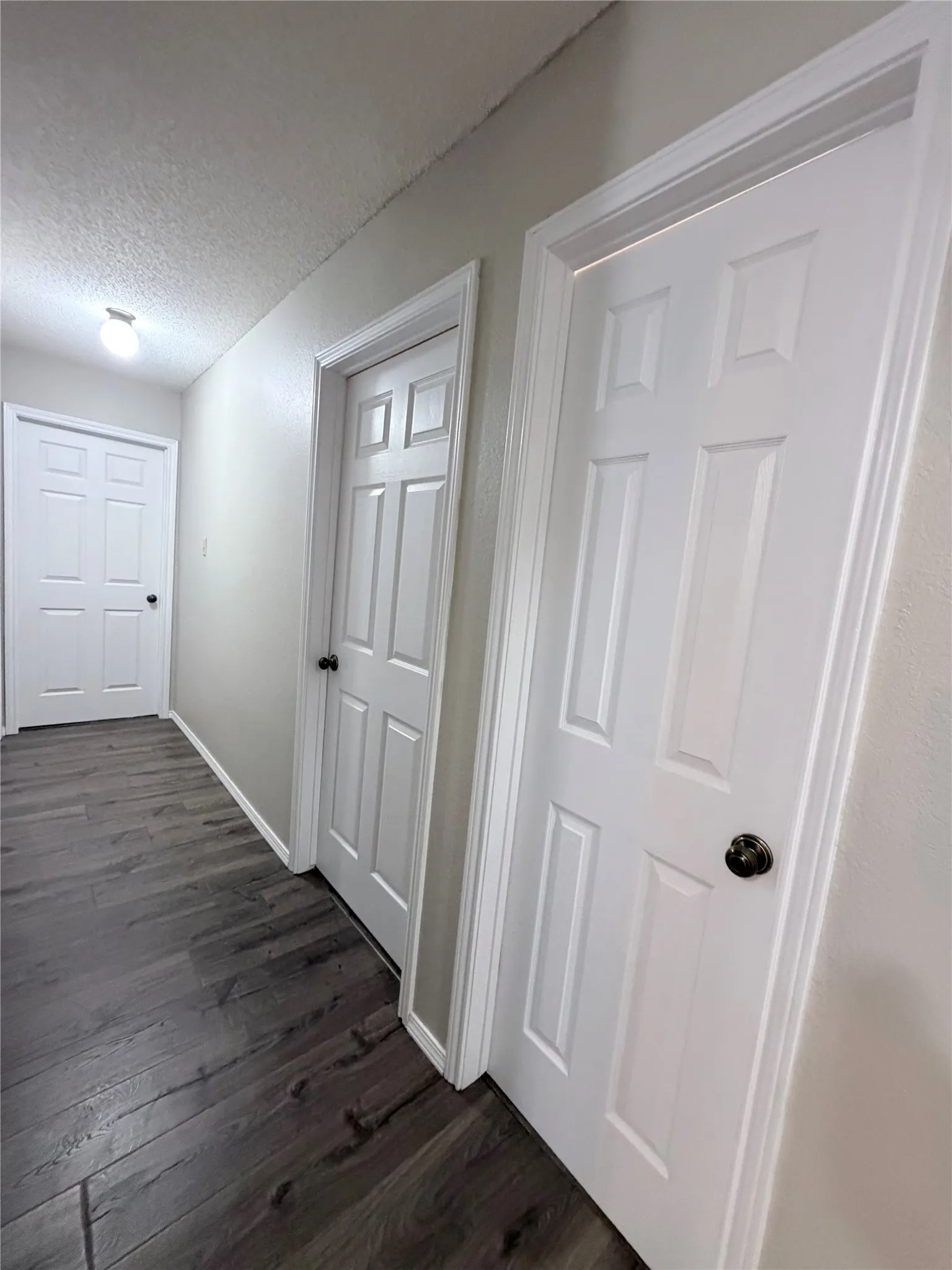 Hallway featuring new 6 panel doors