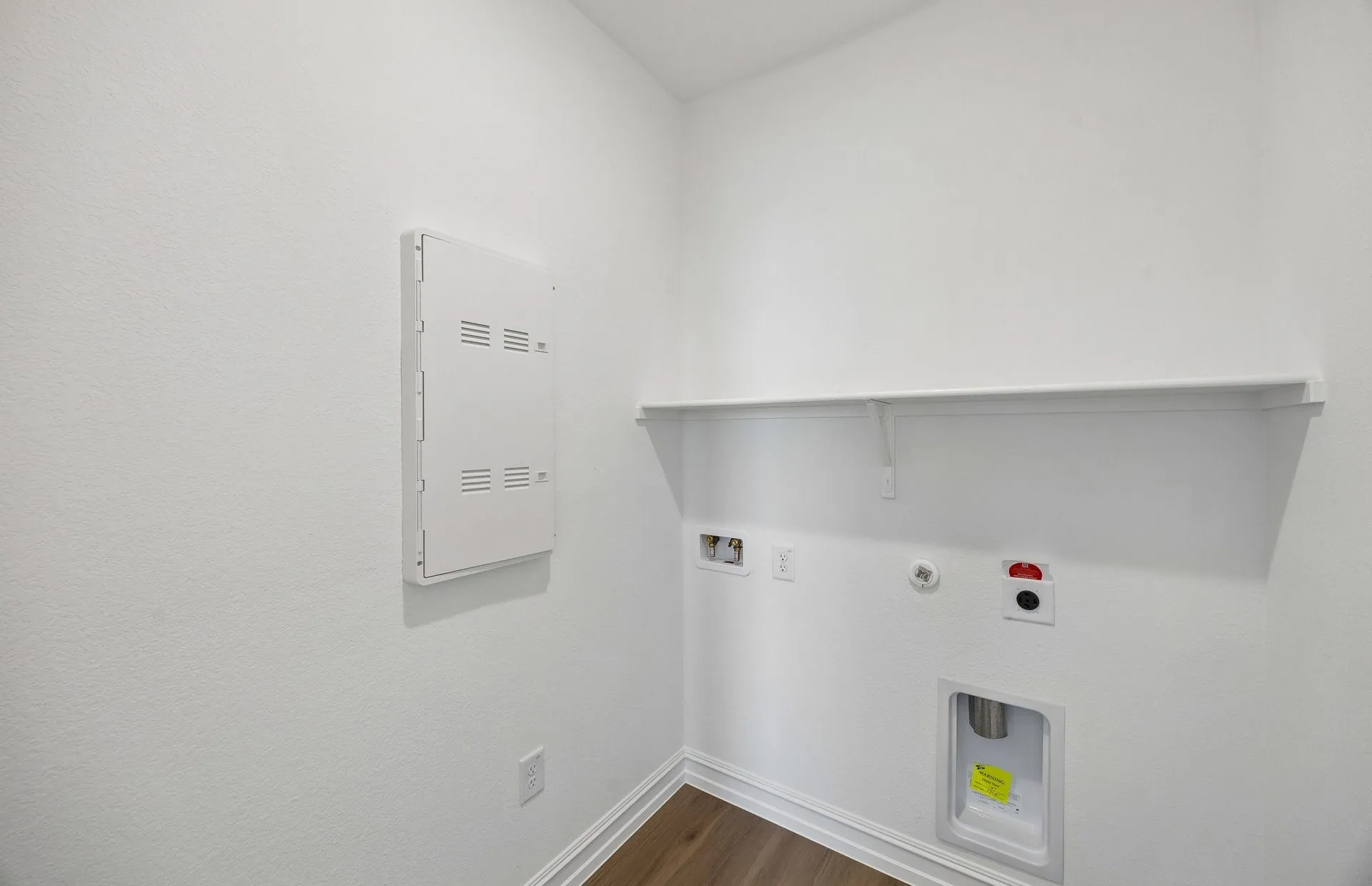 Laundry room with built-in shelving