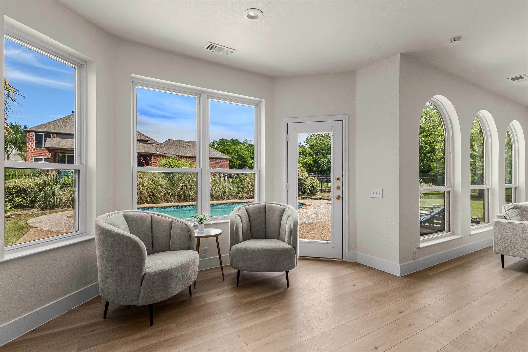 Bright interior space featuring light wood-finish flooring, recessed lighting, and a white baseboard​​‌​​​​‌​​‌‌​‌‌​​​‌‌​‌​‌​‌​​​‌​​ trim
