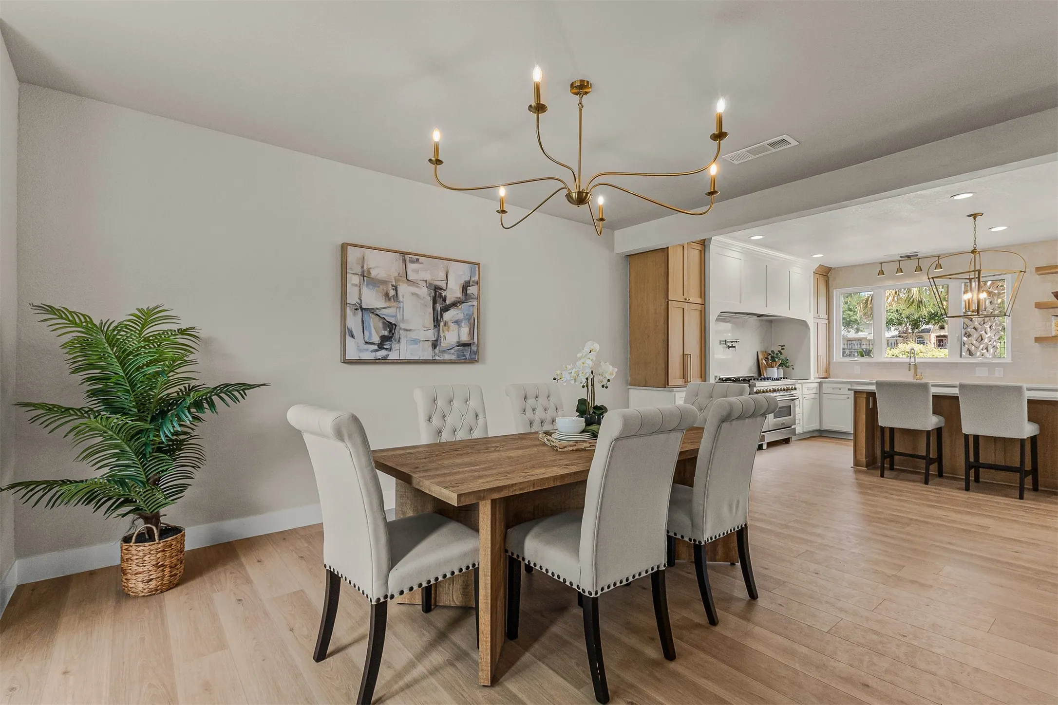 Bright dining area with light wood-finish flooring