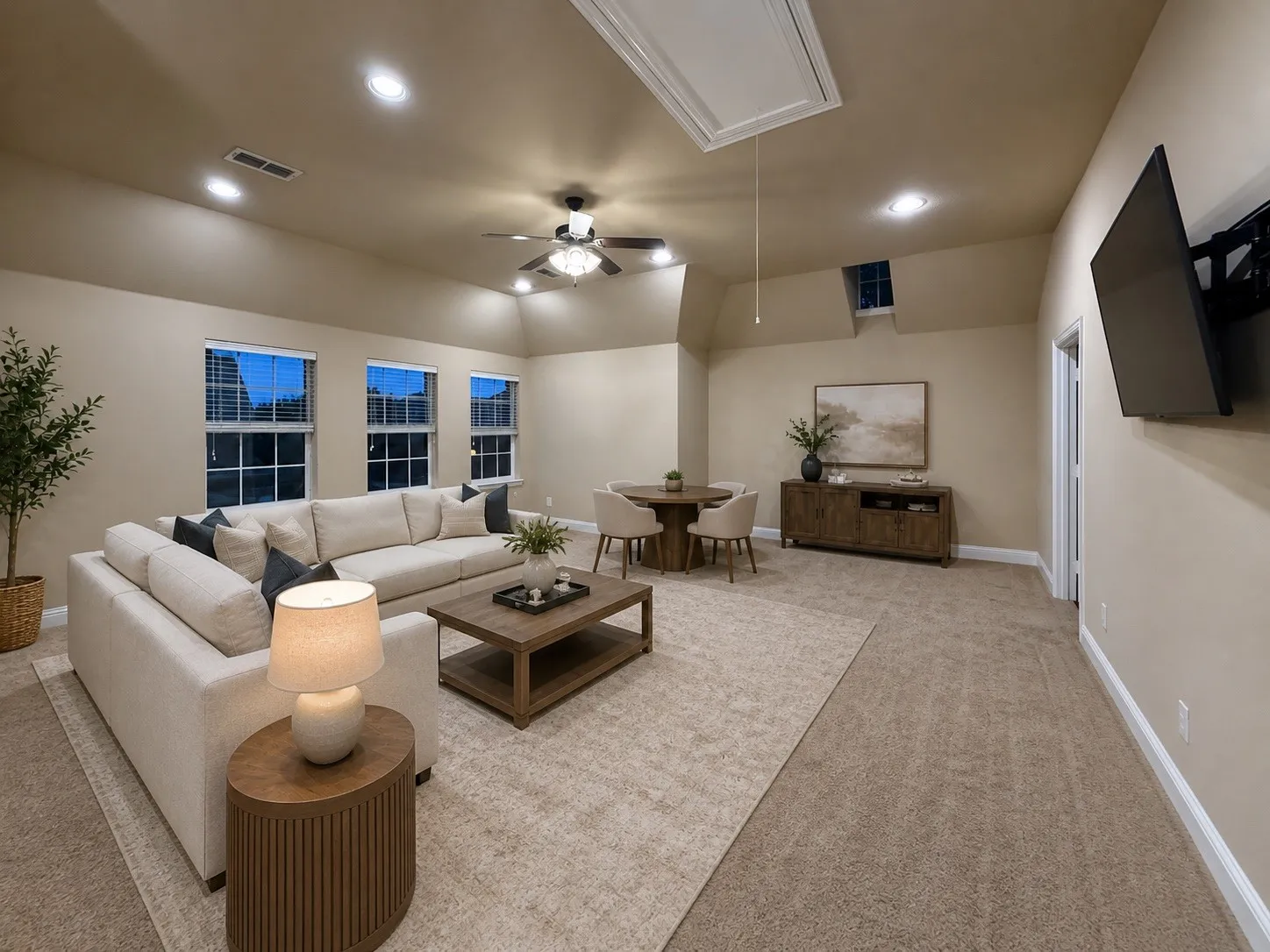 Carpeted room with recessed lighting and a ceiling fan