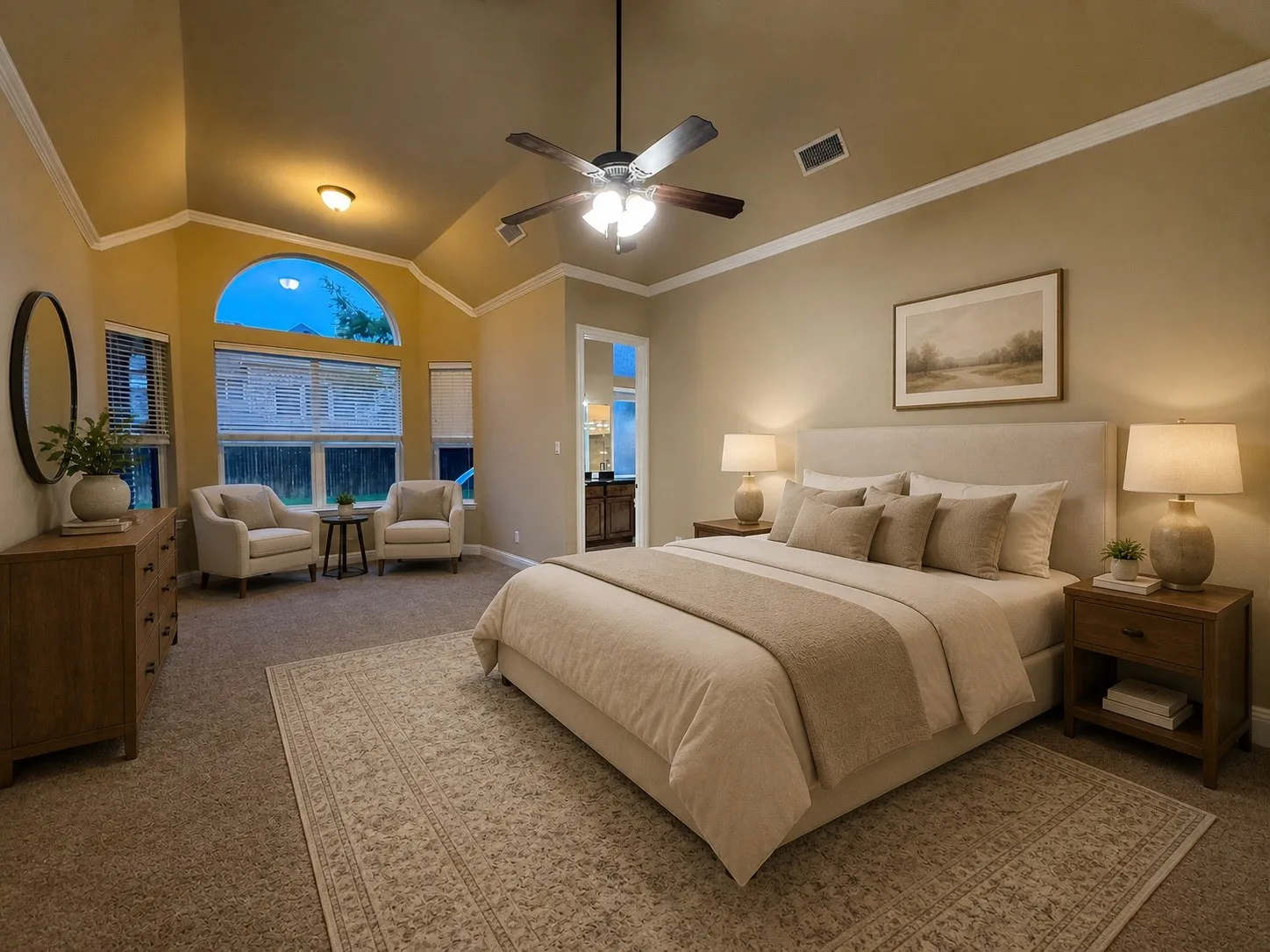 Vaulted ceiling with crown molding, ceiling fan, and recessed lighting