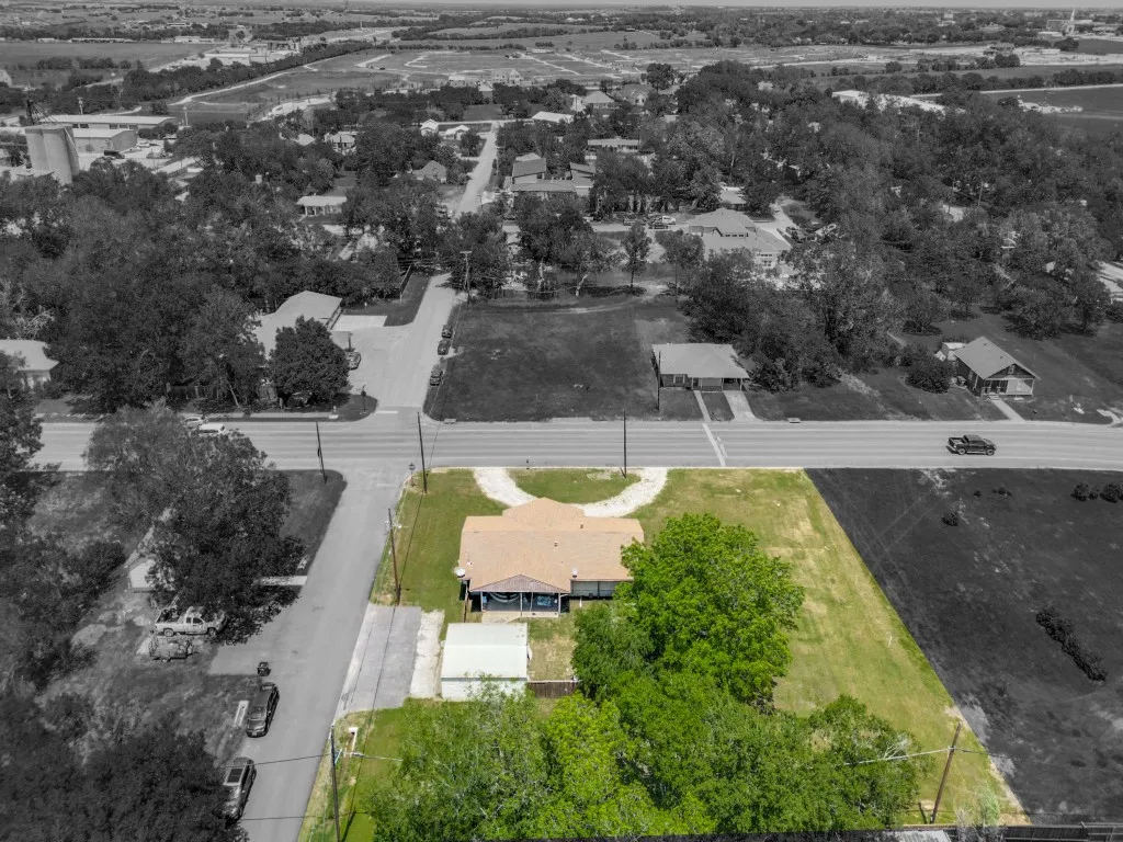 Aerial view, showing the property, continuing to the commercially developed and developing areas North of it along with some residential mixed in. Left is West, Right is East.
