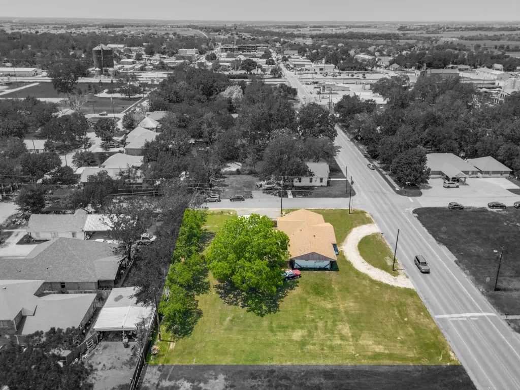 Aerial view, showing the property, continuing on to the Downtown Square. Left is South Right is North.