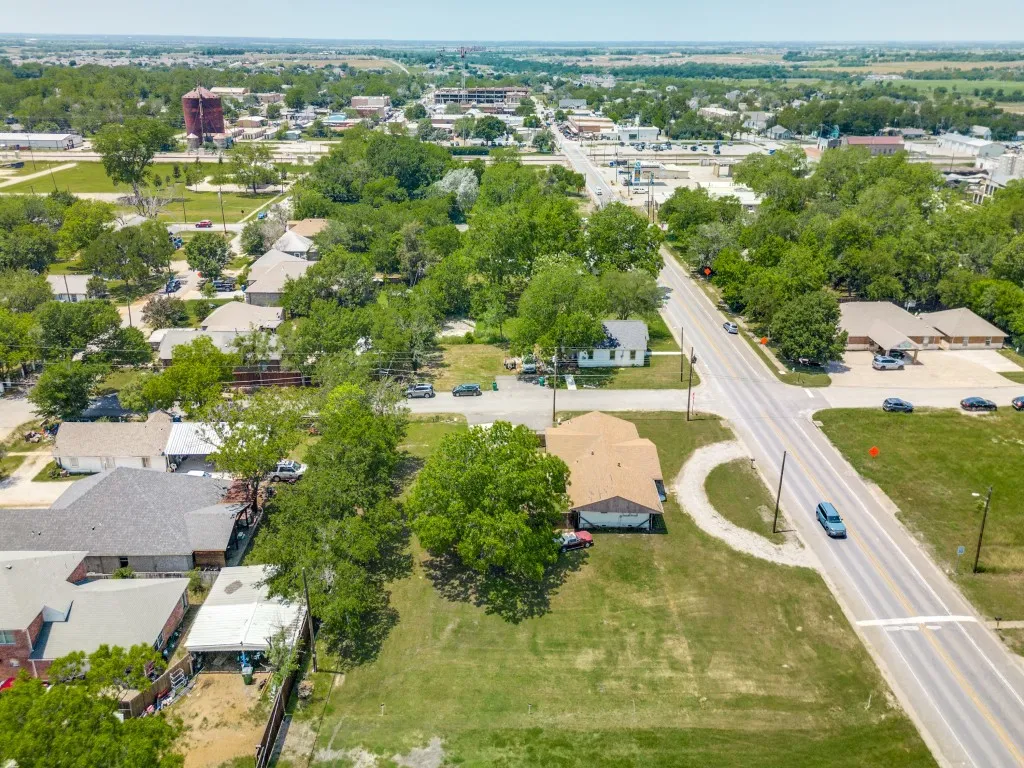 Aerial view, showing the property, continuing on to the Downtown Square. Left is South Right is North.