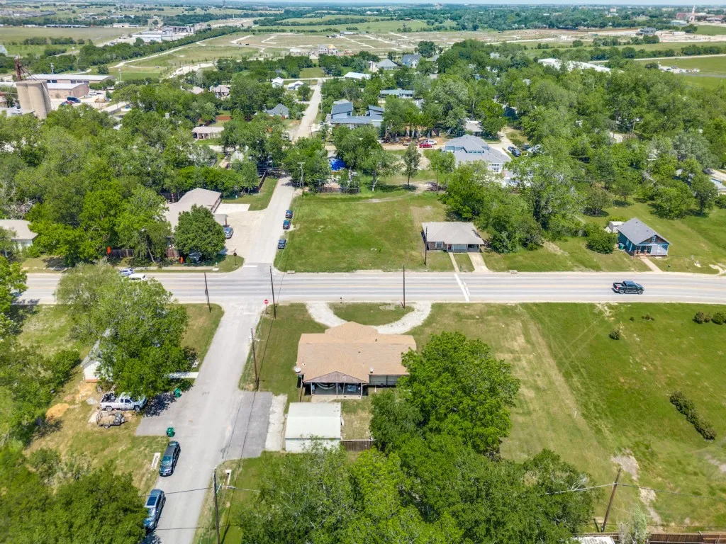 Aerial view, showing the property, continuing to the commercially developed and developing areas North of it along with some residential mixed in. Left is West, Right is East.