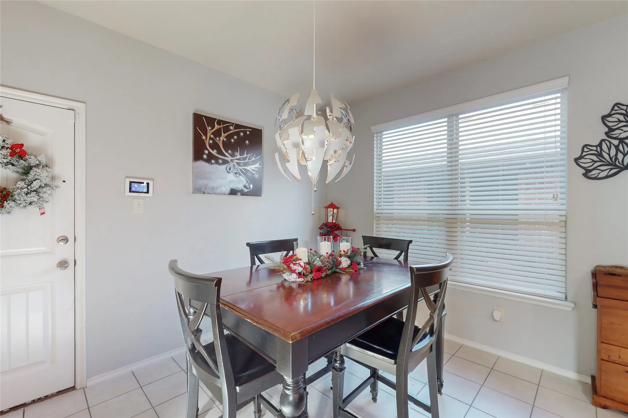Eat-in kitchen with custom lighting.